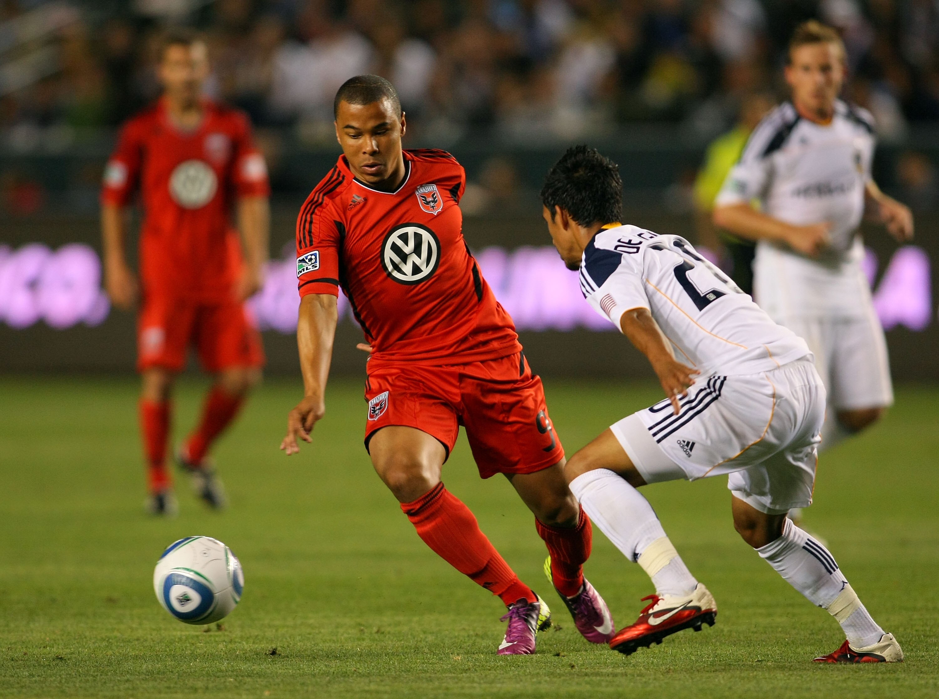 CARSON, CA - JUNE 03:  Charlie Davies #9 of D.C. United looks to dribble the ball past A.J. DeLaGarza #20 of the Los Angeles Galaxy in the second half during their MLS match at The Home Depot Center on June 3, 2011 in Carson, California. United and the Ga