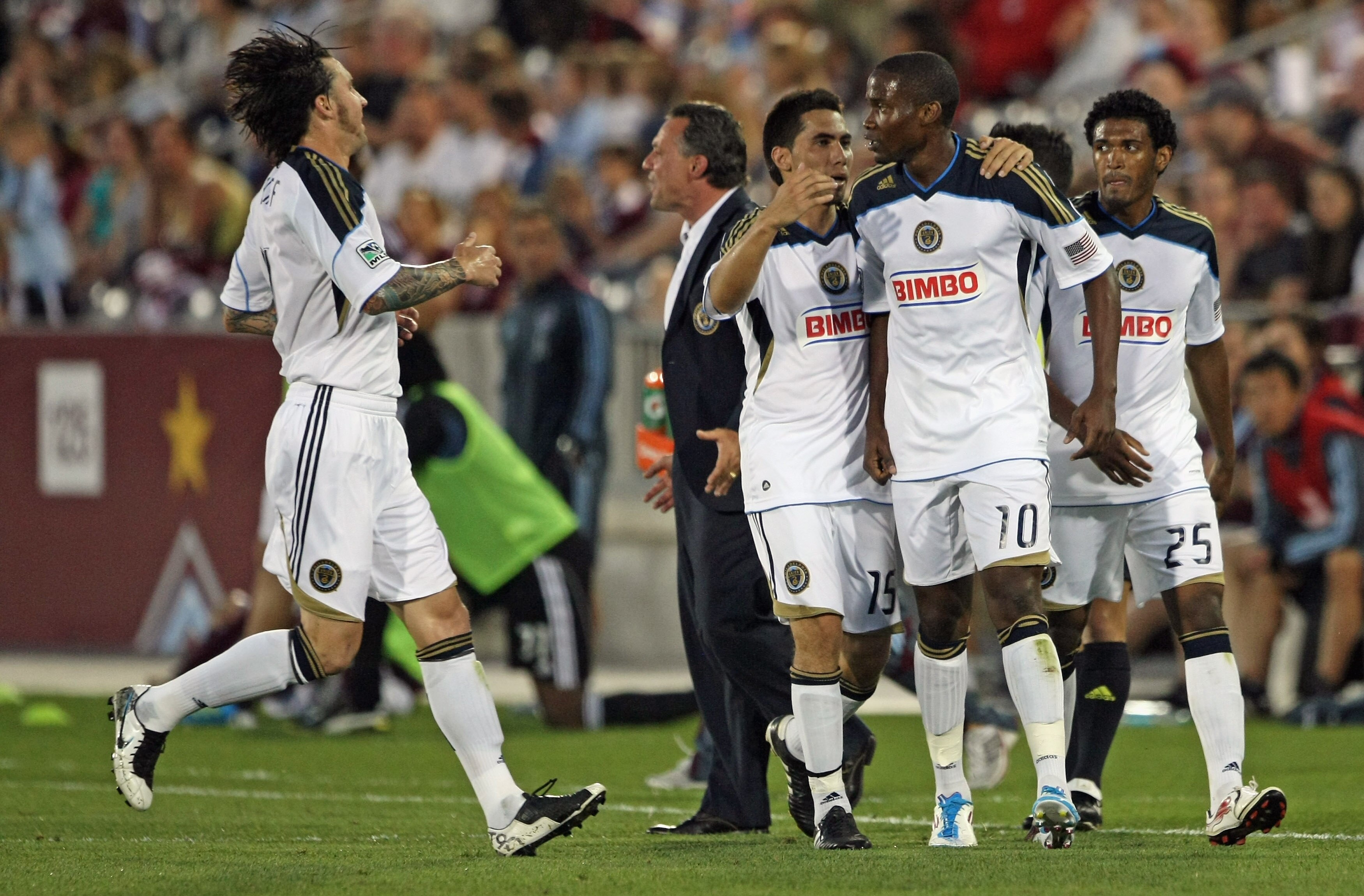 COMMERCE CITY, CO - JUNE 04:  Danny Mwanga #10 of the Philadelphia Union is congratulated by teammates (L-R) Danny Califf #4, Gabriel Farfan #15 and Sheanon Williams #25 of the Union after he scored in the 65th minute to equalize the score 1-1 against the