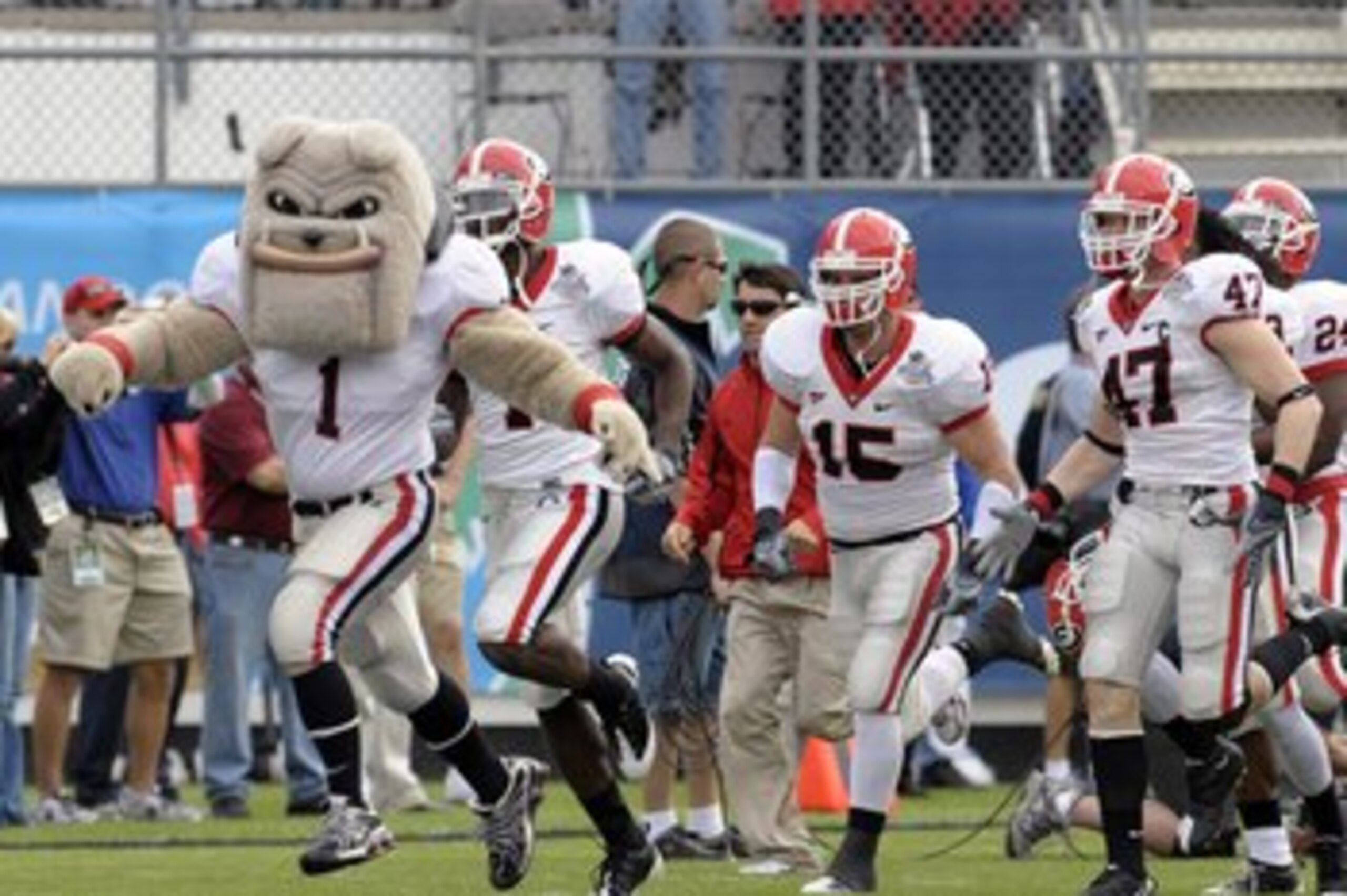 ORLANDO, FL - JANUARY 1: Hairy Dawg, the costumed mascot of the University of Georgia leads the team to the field for play against the Michigan State Spartans at the 2009 Capital One Bowl at the Citrus Bowl on January 1, 2009 in Orlando, Florida.  (Photo