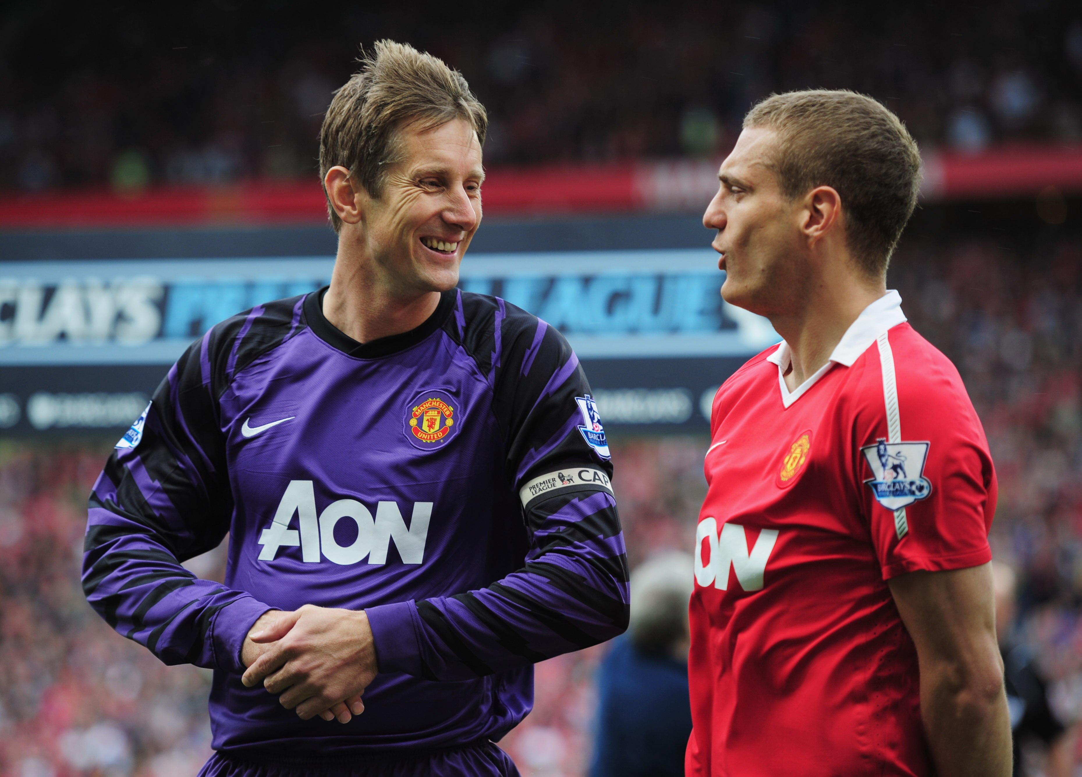 MANCHESTER, ENGLAND - MAY 22:  Edwin van der Sar of Manchester United talks to Nemanja Vidic as he plays his final league match prior to the Barclays Premier League match between Manchester United and Blackpool at Old Trafford on May 22, 2011 in Mancheste