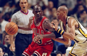 25 May, 1998:  Michael Jordan #23 of the Chicago Bulls dribbles as Reggie Miller #31 of the Indianapolis Pacers guards during the NBA Eastern Conference Finals at the Market Square Arena in Indianapolis, Indiana.  The Pacers defeated the Bulls 96-94. Mand