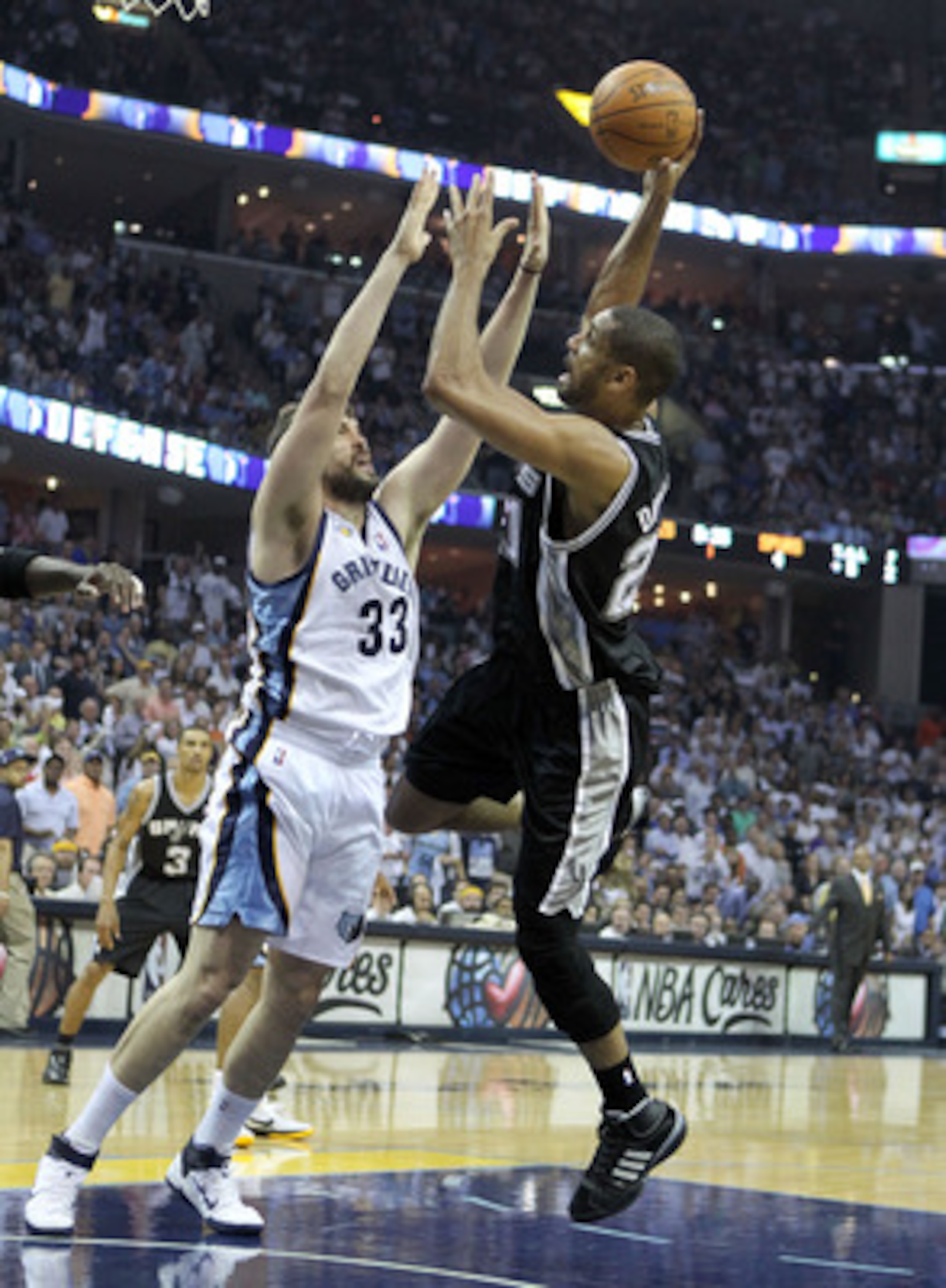 MEMPHIS, TN - APRIL 29:  Tim Duncan #21 of the San Antonio Spurs shoots the ball while defended by Marc Gasol #33 of the Memphis Grizzlies in Game Six of the Western Conference Quarterfinals in the 2011 NBA Playoffs at FedExForum on April 29, 2011 in Memp