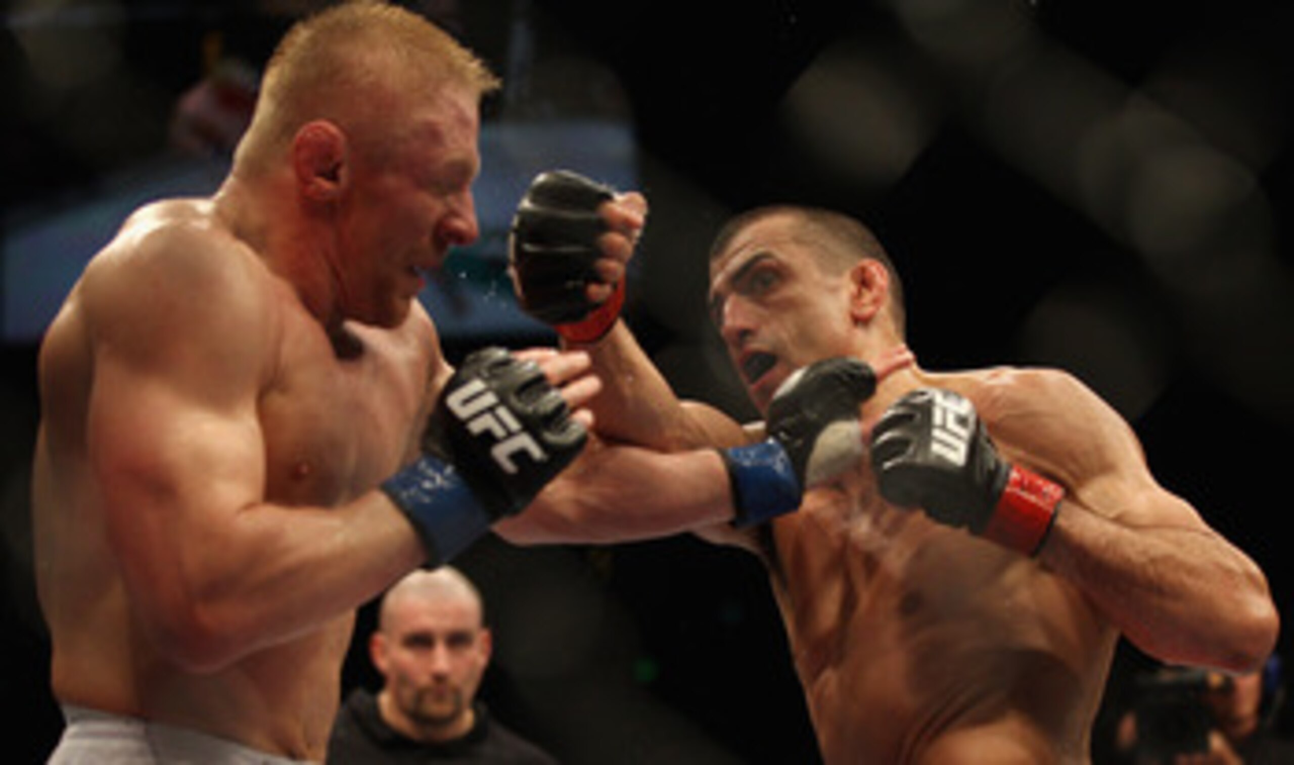 SYDNEY, AUSTRALIA - FEBRUARY 27:  George Sotiropoulos of Australia punches Dennis Silver of Russia during their lightweight bout as part of UFC 127 at Acer Arena on February 27, 2011 in Sydney, Australia.  (Photo by Mark Kolbe/Getty Images)