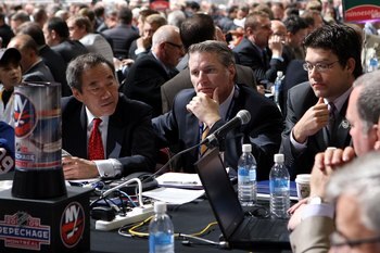 MONTREAL , QC - JUNE 27:  General Manager Garth Snow of the New York Islanders (C) and assistant General Manager Ryan Jankowski (R) sit at the draft table during the second day of the 2009 NHL Entry Draft at the Bell Centre on June 27, 2009 in Montreal, Q