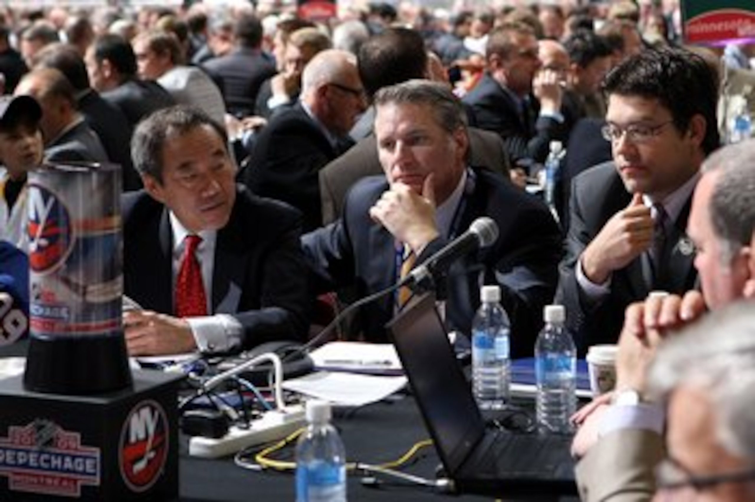MONTREAL , QC - JUNE 27: General Manager Garth Snow of the New York Islanders (C) and assistant General Manager Ryan Jankowski (R) sit at the draft table during the second day of the 2009 NHL Entry Draft at the Bell Centre on June 27, 2009 in Montreal, Q MONTREAL , QC - JUNE 27: General Manager Garth Snow of the New York Islanders (C) and assistant General Manager Ryan Jankowski (R) sit at the draft table during the second day of the 2009 NHL Entry Draft at the Bell Centre on June 27, 2009 in Montreal, Q