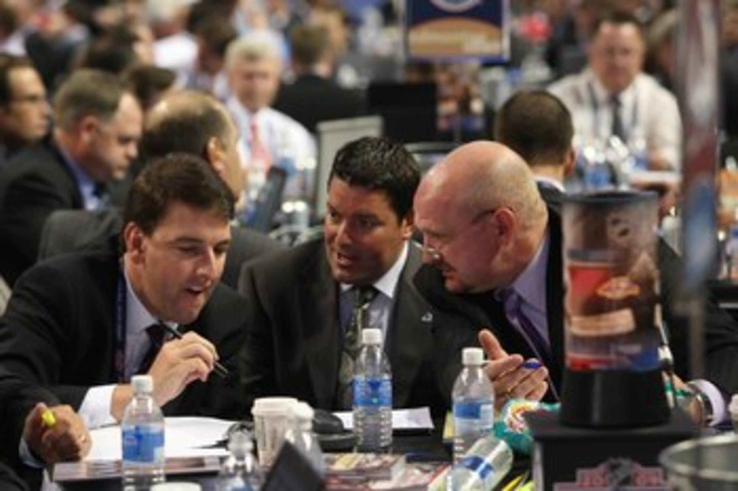 MONTREAL - JUNE 26: Colorado Avalanche General Manager Greg Sherman (l) confers with scouts Richard Pracey and Alan Hepple during the first round of the 2009 NHL Entry Draft at the Bell Centre on June 26, 2009 in Montreal, Quebec, Canada. (Photo by Bruce MONTREAL - JUNE 26: Colorado Avalanche General Manager Greg Sherman (l) confers with scouts Richard Pracey and Alan Hepple during the first round of the 2009 NHL Entry Draft at the Bell Centre on June 26, 2009 in Montreal, Quebec, Canada. (Photo by Bruce