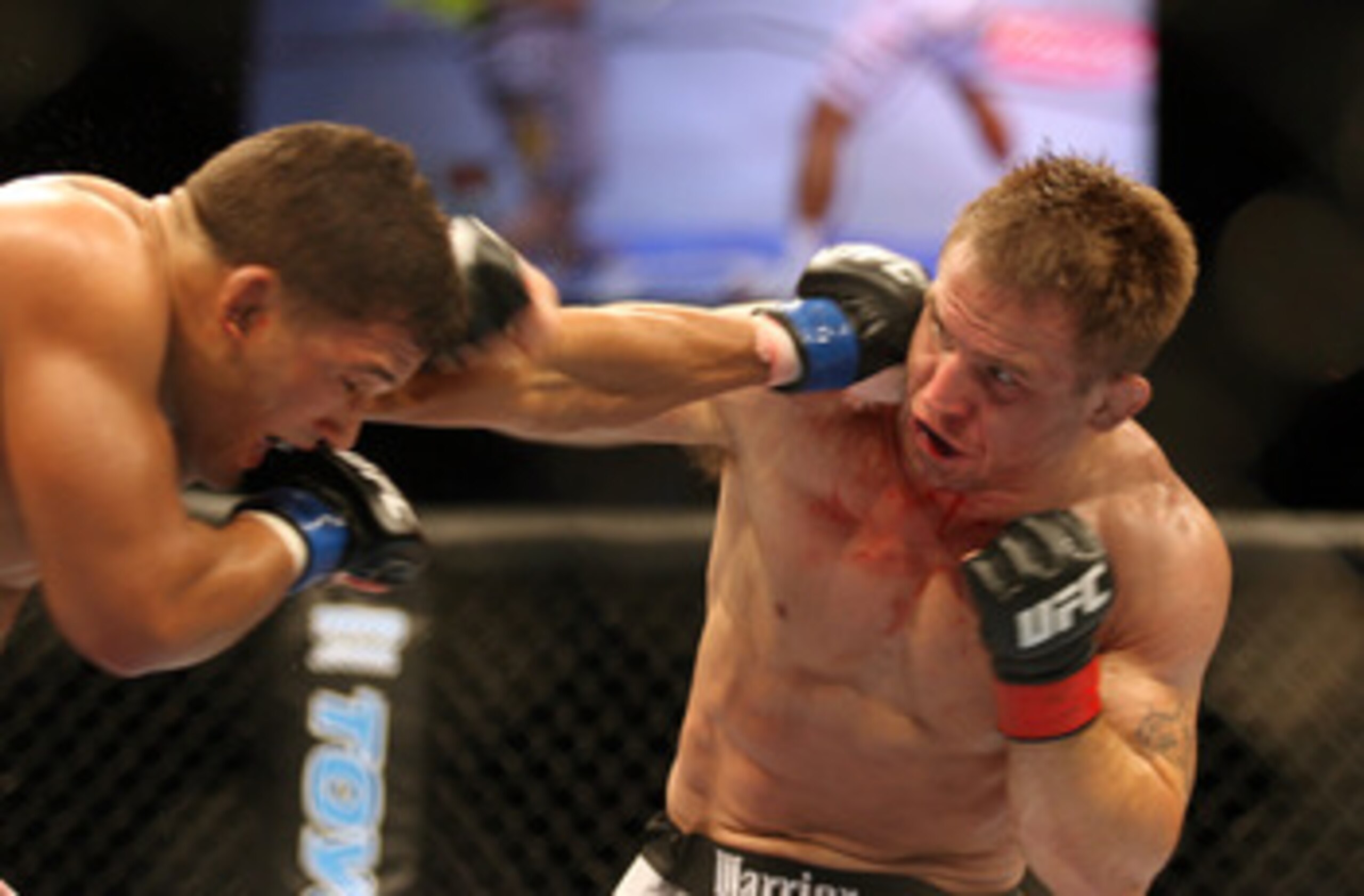 CHICAGO- OCTOBER 25:  Tyson Griffin (L) punches Sean Sherk in a Lightweight bout at UFC's Ultimate Fight Night at Allstate Arena on October 25, 2008 in Chicago, Illinois. (Photo by Tasos Katopodis/Getty Images)