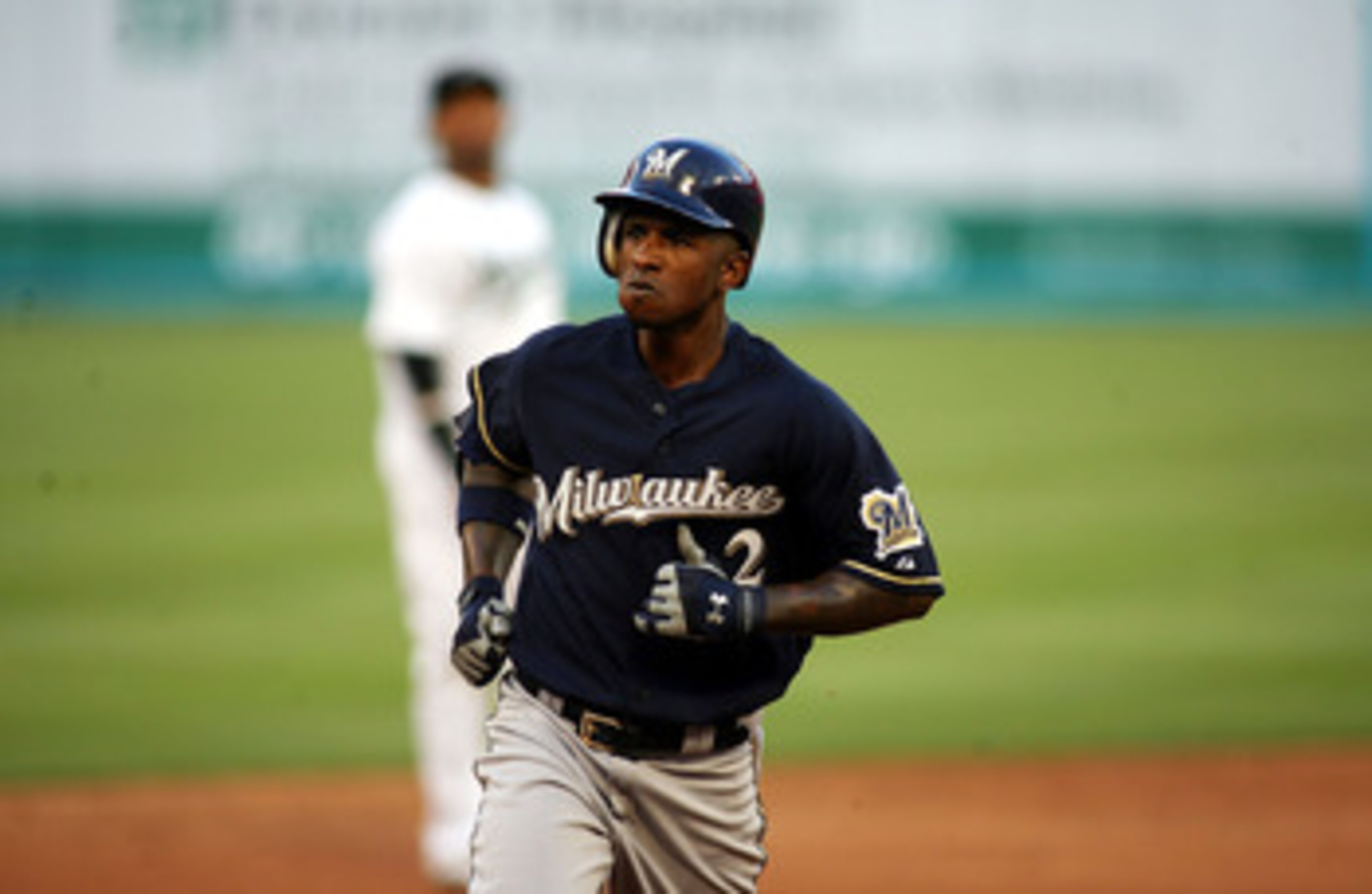 MIAMI GARDENS, FL - JUNE 04:  Nyjer Morgan #2 of the Milwaukee Brewers hits a home run against the Florida Marlins at Sun Life Stadium on June 4, 2011 in Miami Gardens, Florida.  (Photo by Marc Serota/Getty Images)