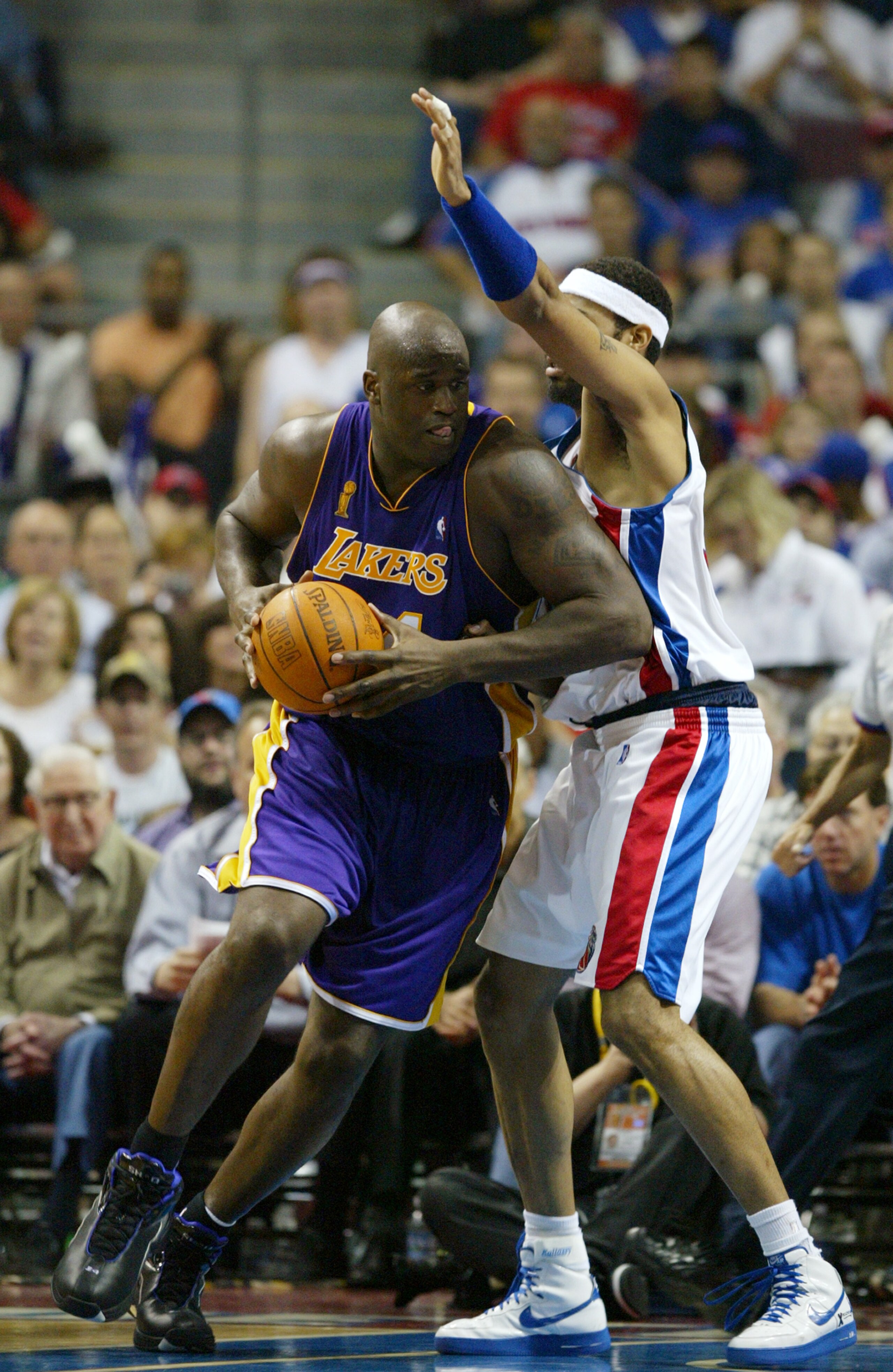 AUBURN HILLS, MI - JUNE 13: Shaquille O'Neal #34 of the Los Angeles Lakers is defended by Rasheed Wallace #30 of the Detroit Pistons in Game four of the 2004 NBA Finals at The Palace of Auburn Hills on June 13, 2004 in Auburn Hills, Michigan. The Piston AUBURN HILLS, MI - JUNE 13: Shaquille O'Neal #34 of the Los Angeles Lakers is defended by Rasheed Wallace #30 of the Detroit Pistons in Game four of the 2004 NBA Finals at The Palace of Auburn Hills on June 13, 2004 in Auburn Hills, Michigan. The Piston