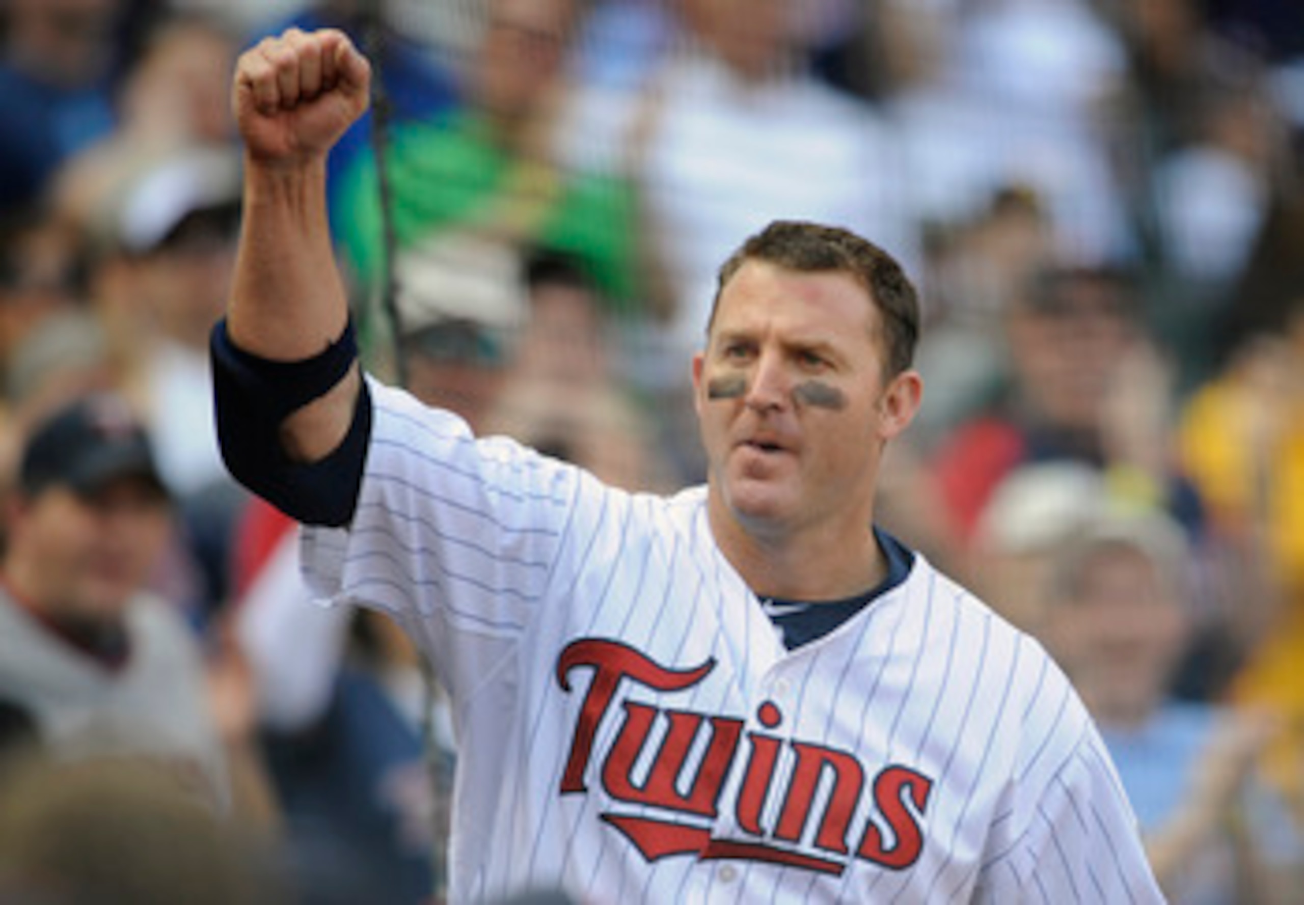MINNEAPOLIS, MN - APRIL 10: Designated hitter Jim Thome #25 of the Minnesota Twins comes out for a curtain call following a two-run homer off Jerry Blevins #13 of the Oakland Athletics during the eighth inning of their game on April 10, 2011 at Target Fie