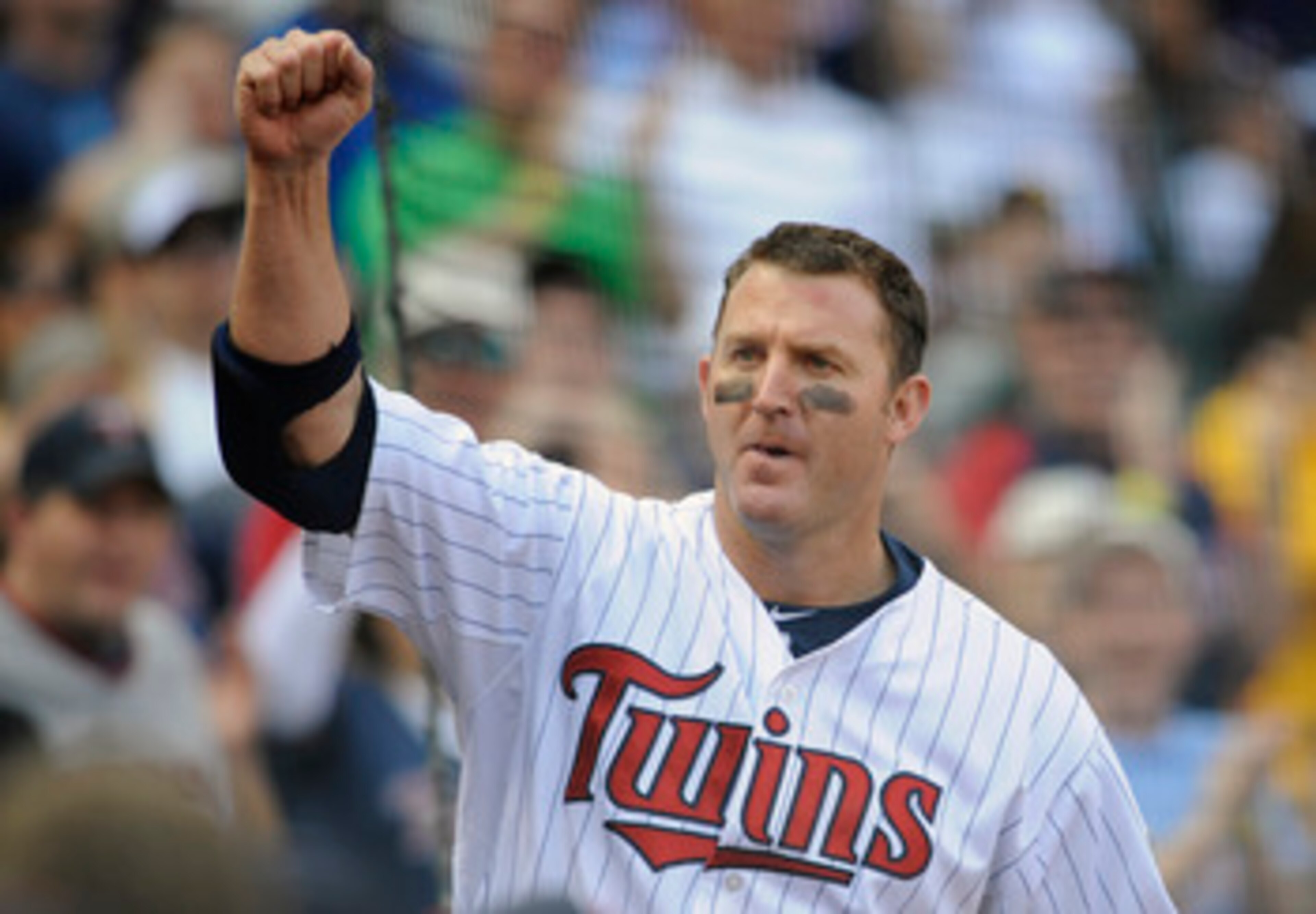 MINNEAPOLIS, MN - APRIL 10: Designated hitter Jim Thome #25 of the Minnesota Twins comes out for a curtain call following a two-run homer off Jerry Blevins #13 of the Oakland Athletics during the eighth inning of their game on April 10, 2011 at Target Fie