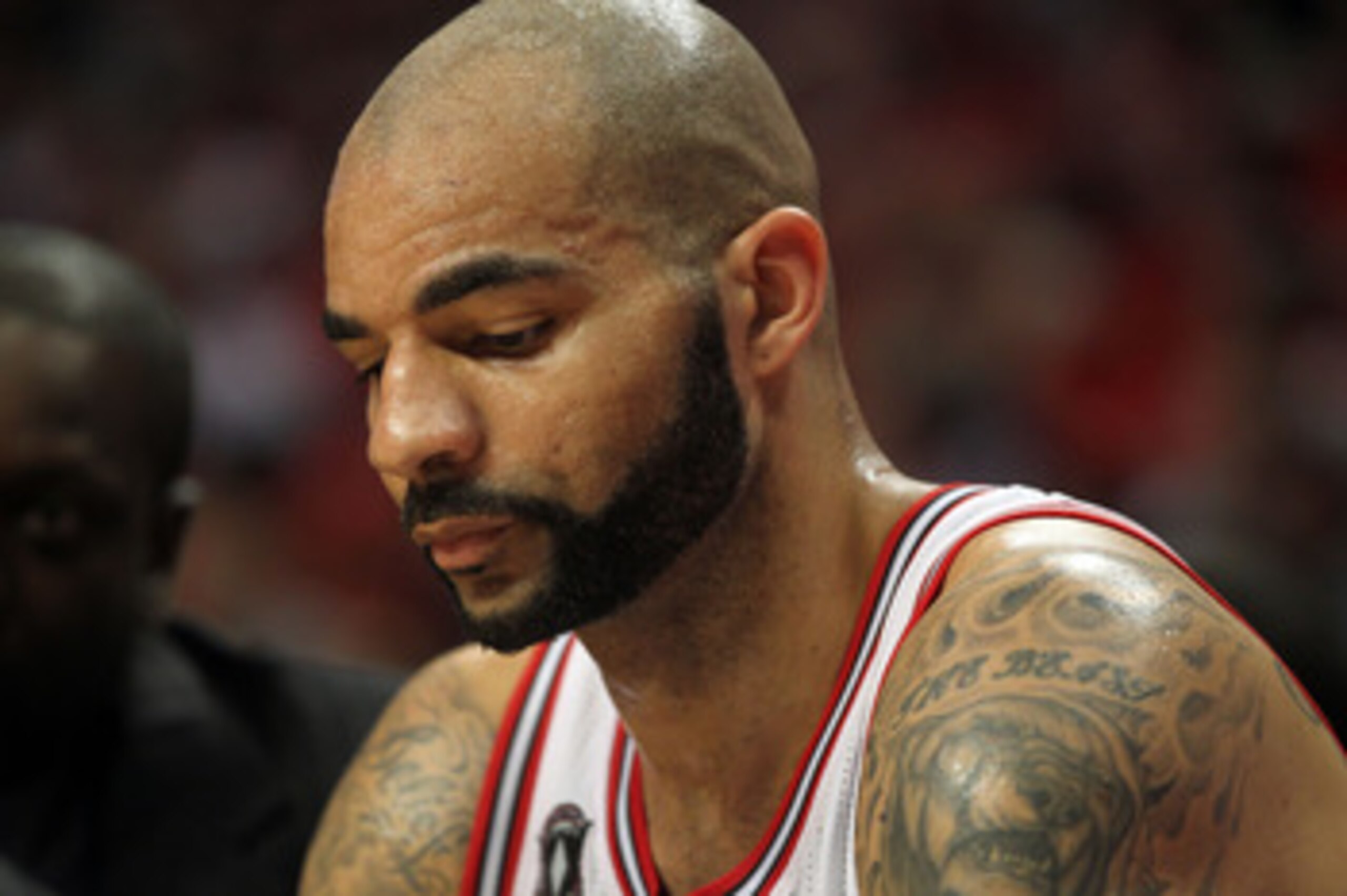 CHICAGO, IL - MAY 26:  Carlos Boozer #5 of the Chicago Bulls sits on the bench with his head down agaimnst the Miami Heat in Game Five of the Eastern Conference Finals during the 2011 NBA Playoffs on May 26, 2011 at the United Center in Chicago, Illinois.
