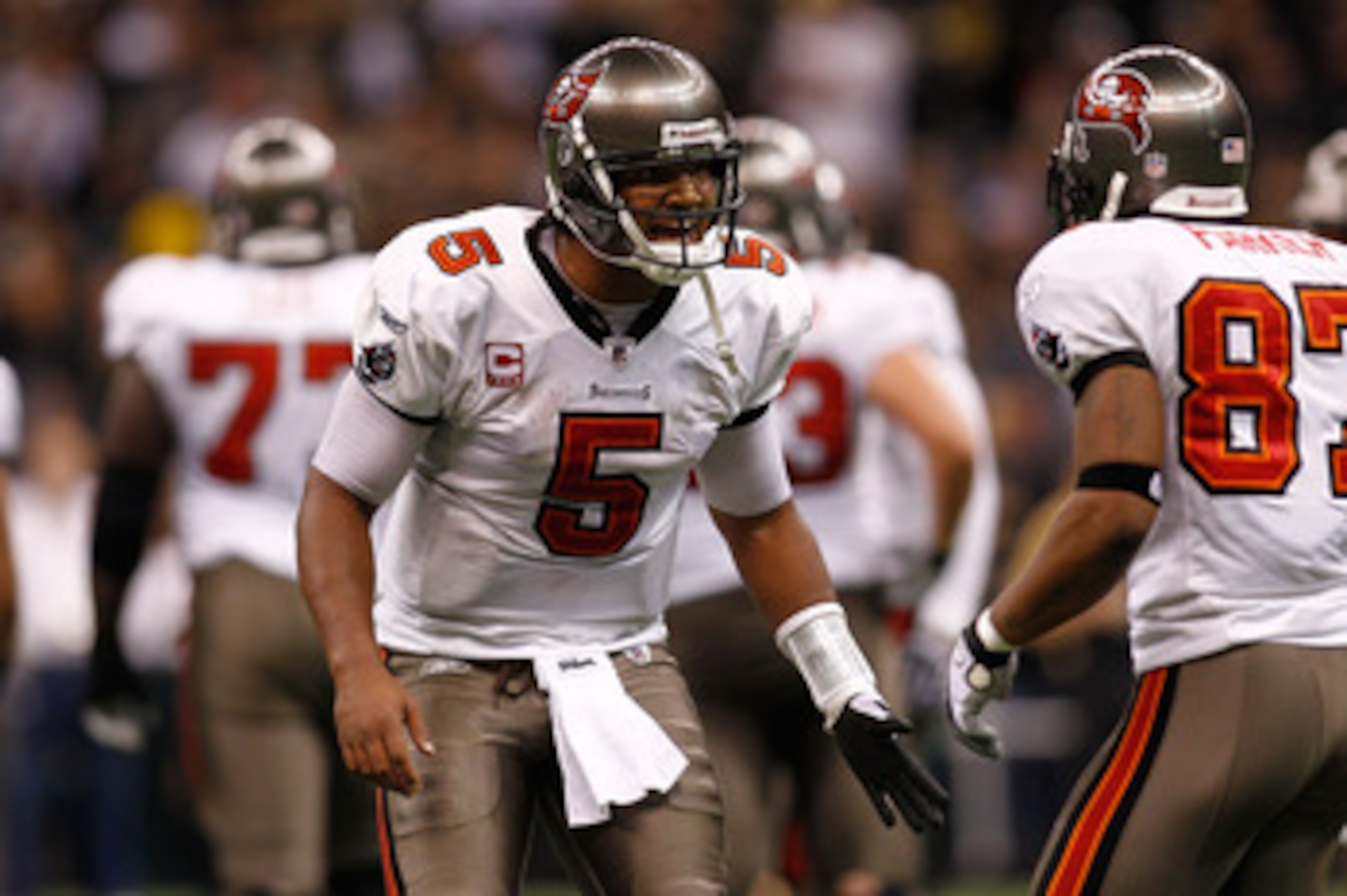 NEW ORLEANS, LA - JANUARY 02:  Quarterback Josh Freeman #5 talks with Preston Parker #87 of the Tampa Bay Buccaneers during the game against the New Orleans Saints at the Louisiana Superdome on January 2, 2011 in New Orleans, Louisiana.   The Buccaneers d
