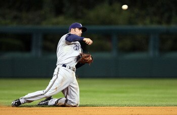 PHILADELPHIA - OCTOBER 02:  J.J. Hardy #7 of the Milwaukee Brewers makes a throw to first for the out from his knees against the Philadelphia Phillies during Game 2 of the NLDS Playoffs at Citizens Bank Ballpark on October 2, 2008 in Philadelphia, Pennsyl