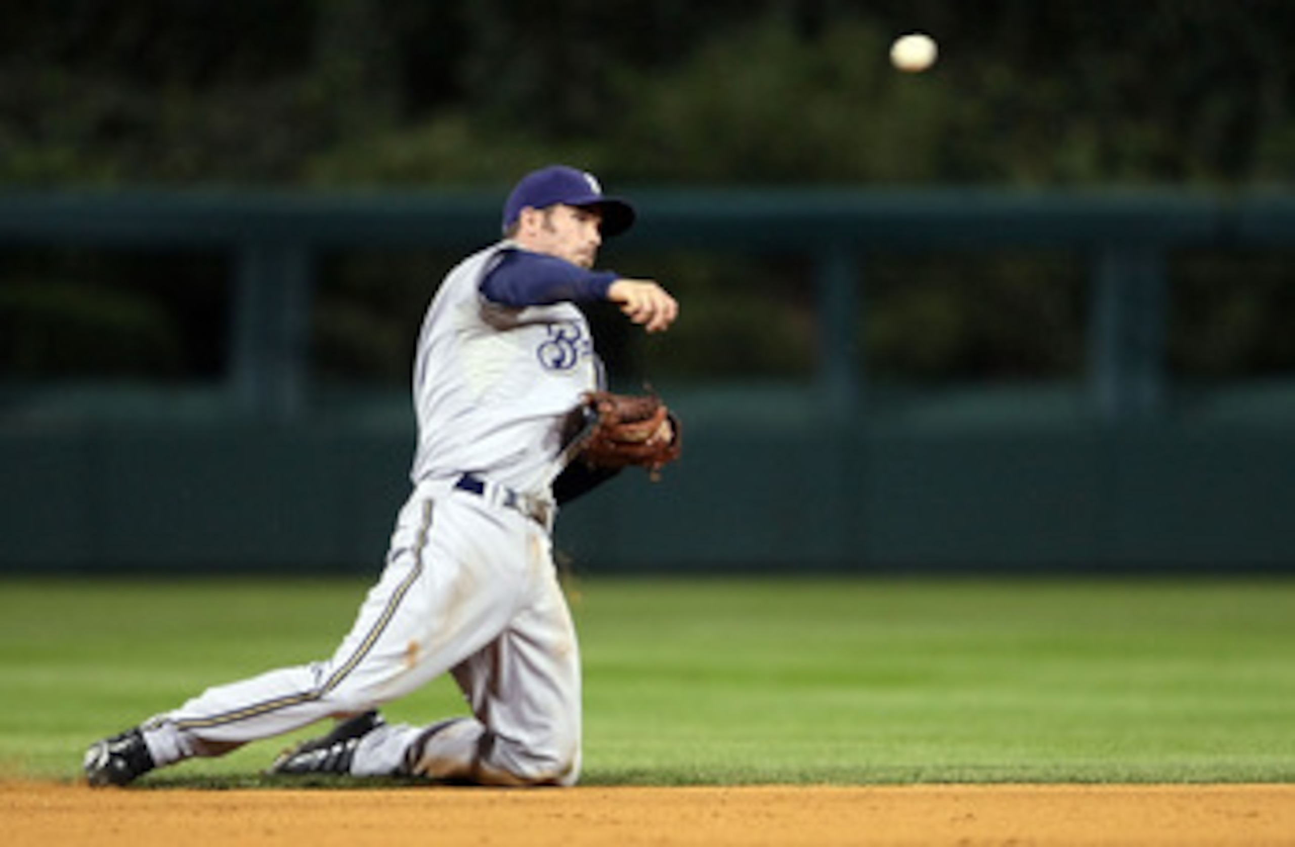 PHILADELPHIA - OCTOBER 02:  J.J. Hardy #7 of the Milwaukee Brewers makes a throw to first for the out from his knees against the Philadelphia Phillies during Game 2 of the NLDS Playoffs at Citizens Bank Ballpark on October 2, 2008 in Philadelphia, Pennsyl