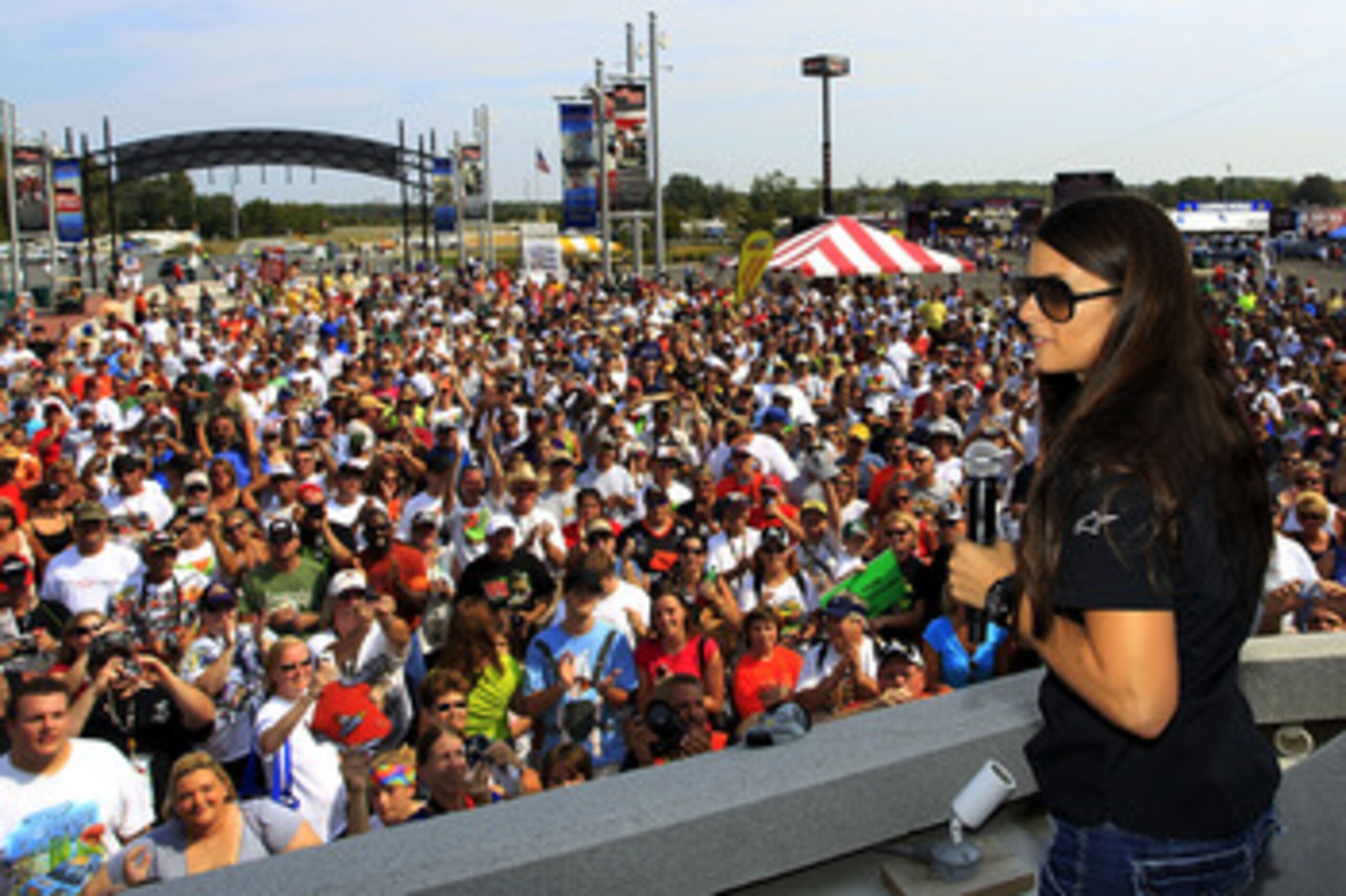 DOVER, DE - SEPTEMBER 25: Danica Patrick (R), driver of the #7 GoDaddy.com Chevrolet, speaks to fans at Dover International Speedway on September 25, 2010 in Dover, Delaware. (Photo by Chris Trotman/Getty Images) DOVER, DE - SEPTEMBER 25: Danica Patrick (R), driver of the #7 GoDaddy.com Chevrolet, speaks to fans at Dover International Speedway on September 25, 2010 in Dover, Delaware. (Photo by Chris Trotman/Getty Images)