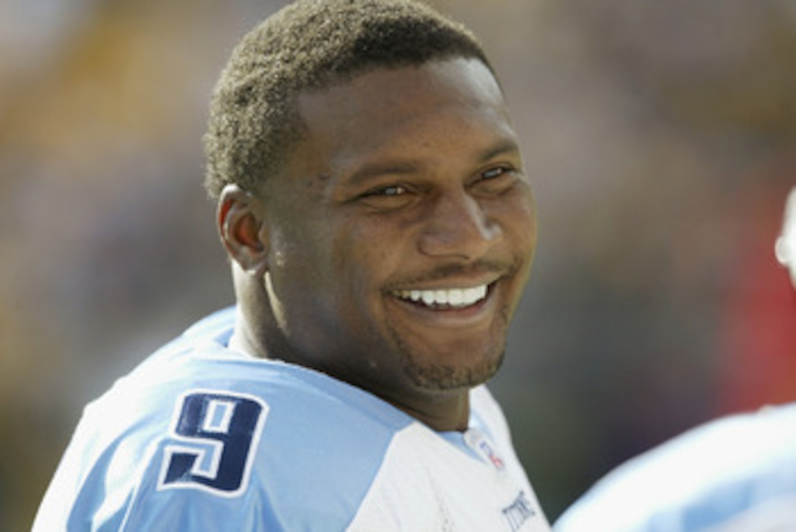 PITTSBURGH-SEPTEMBER 28:  Steve McNair #9 of the Tennessee Titans smiles while talking to a teammate during the game against the Pittsburgh Steelers on September 28, 2003 at Heinz Field in Pittsburgh, Pennsylvania. The Titans defeated the Steelers 30-13. 