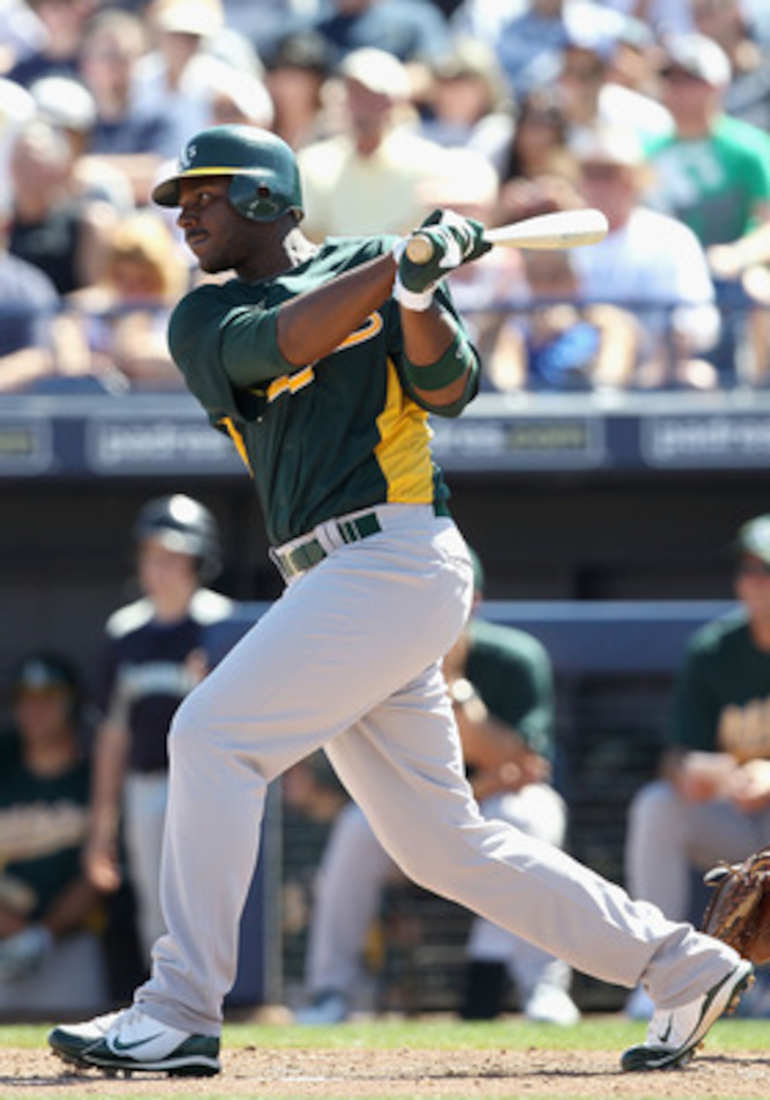 PEORIA, AZ - MARCH 12:  Chris Carter #22 of the Oakland Athletics bats against the Seattle Mariners during the spring training game at Peoria Stadium on March 12, 2011 in Peoria, Arizona.  (Photo by Christian Petersen/Getty Images)