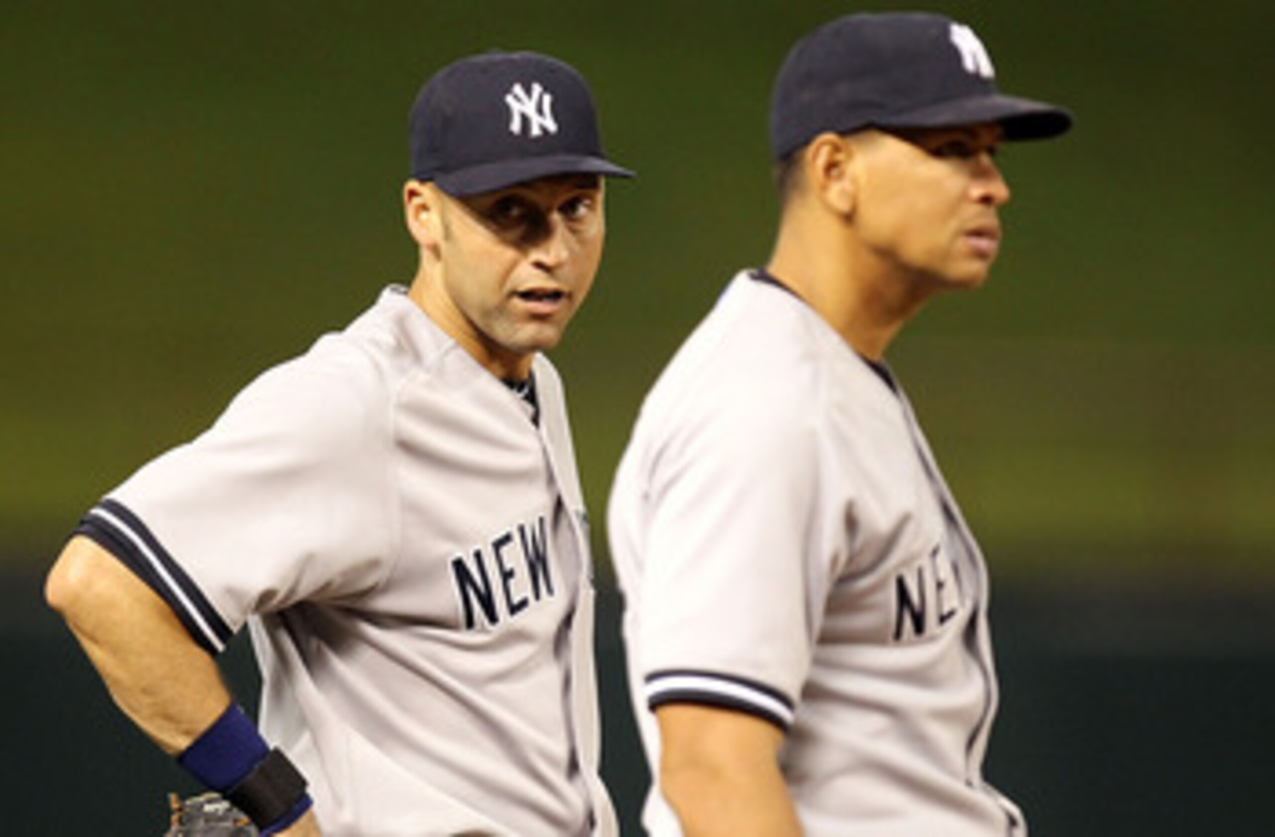 ARLINGTON, TX - MAY 07:  Derek Jeter #2 and Alex Rodriguez #13 of the New York Yankees talk between innings at Rangers Ballpark in Arlington on May 7, 2011 in Arlington, Texas.  (Photo by Ronald Martinez/Getty Images)