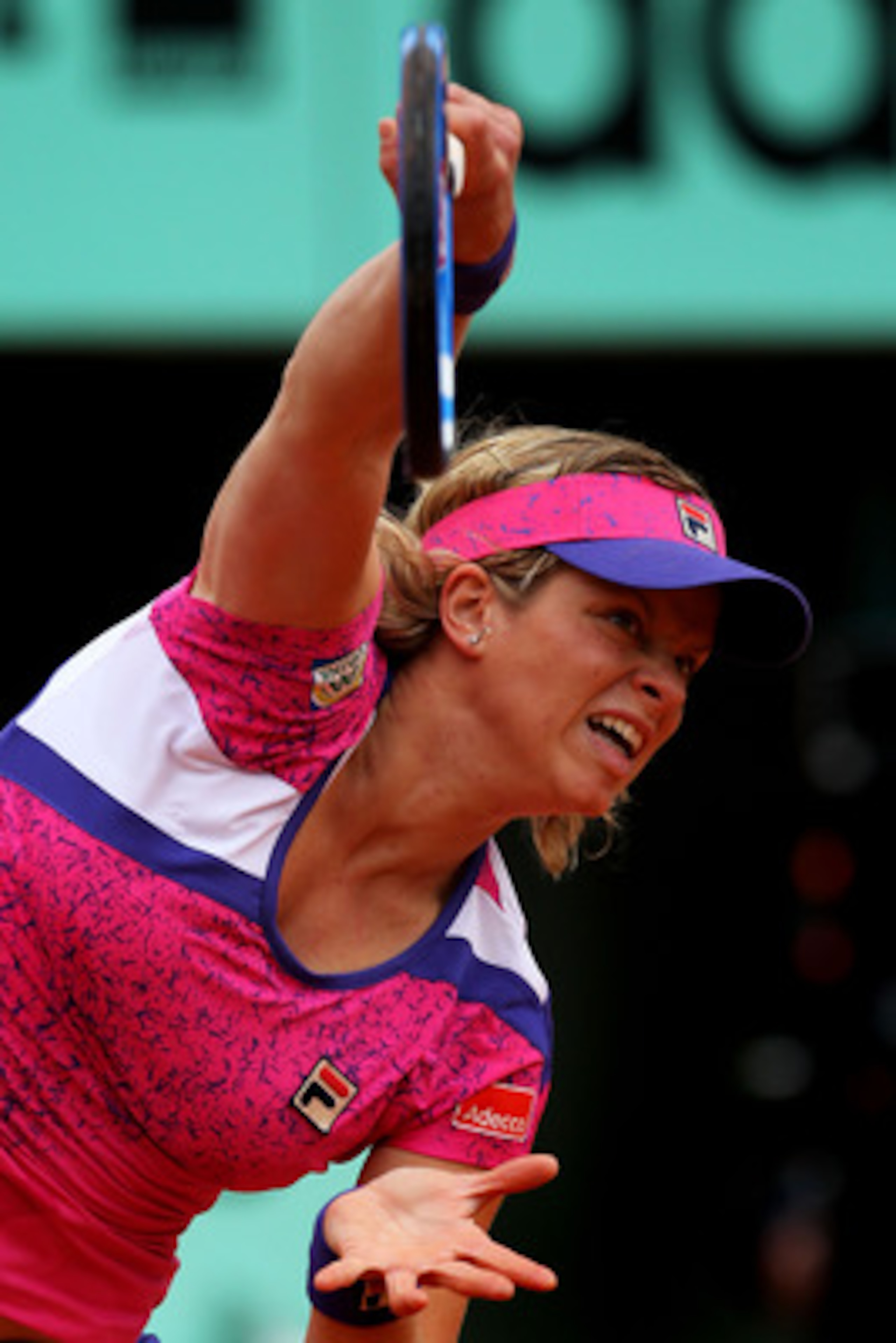 PARIS, FRANCE - MAY 26:  Kim Clijsters of Belgium serves during the women's singles round two match between Arantxa Rus of Netherlands and Kim Clijsters of Belgium on day five of the French Open at Roland Garros on May 26, 2011 in Paris, France.  (Photo b