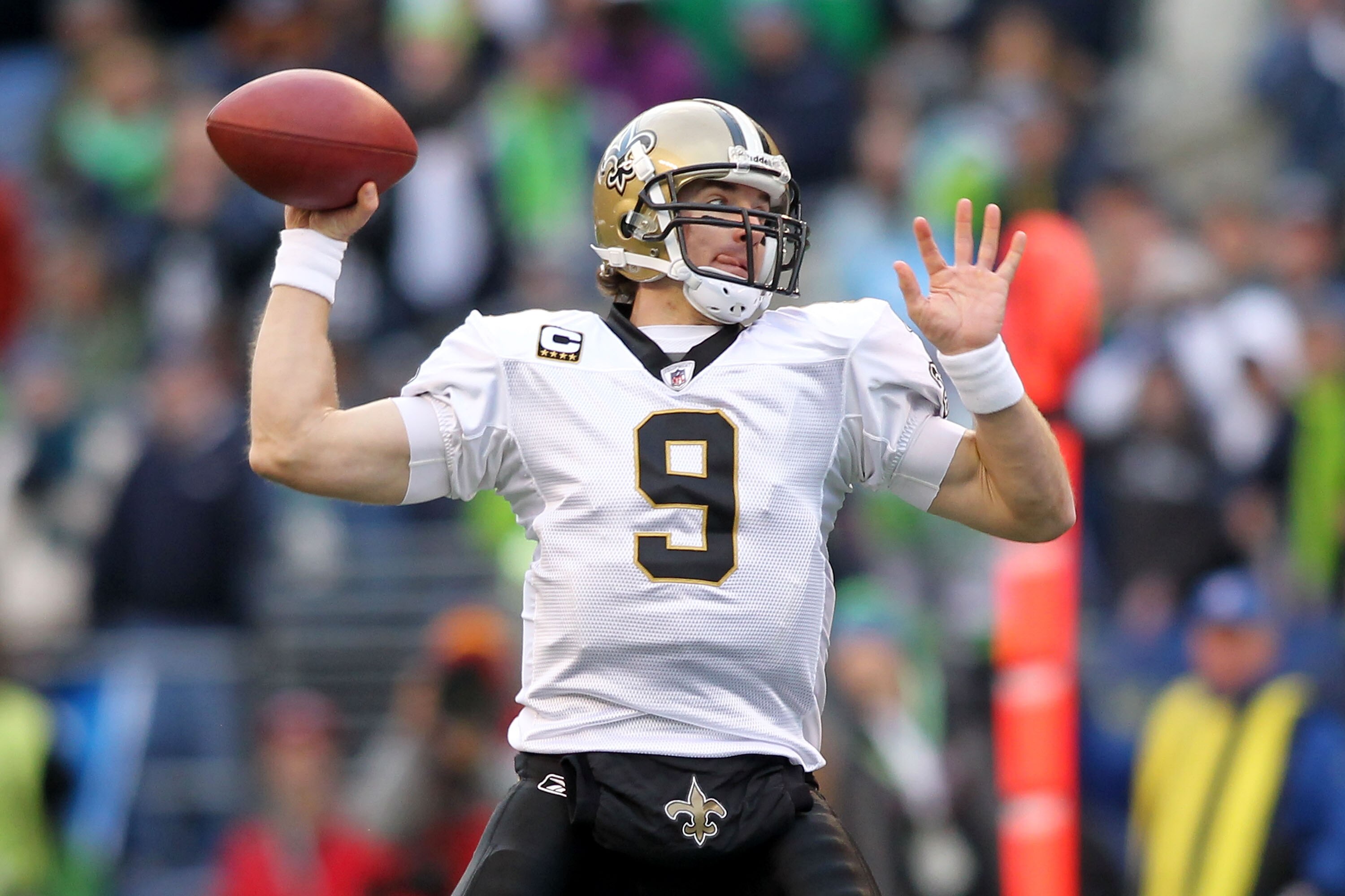 SEATTLE, WA - JANUARY 08:  Quarterback Drew Brees #9 of the New Orleans Saints throws the ball against the Seattle Seahawks during the 2011 NFC wild-card playoff game at Qwest Field on January 8, 2011 in Seattle, Washington.  (Photo by Jonathan Ferrey/Get