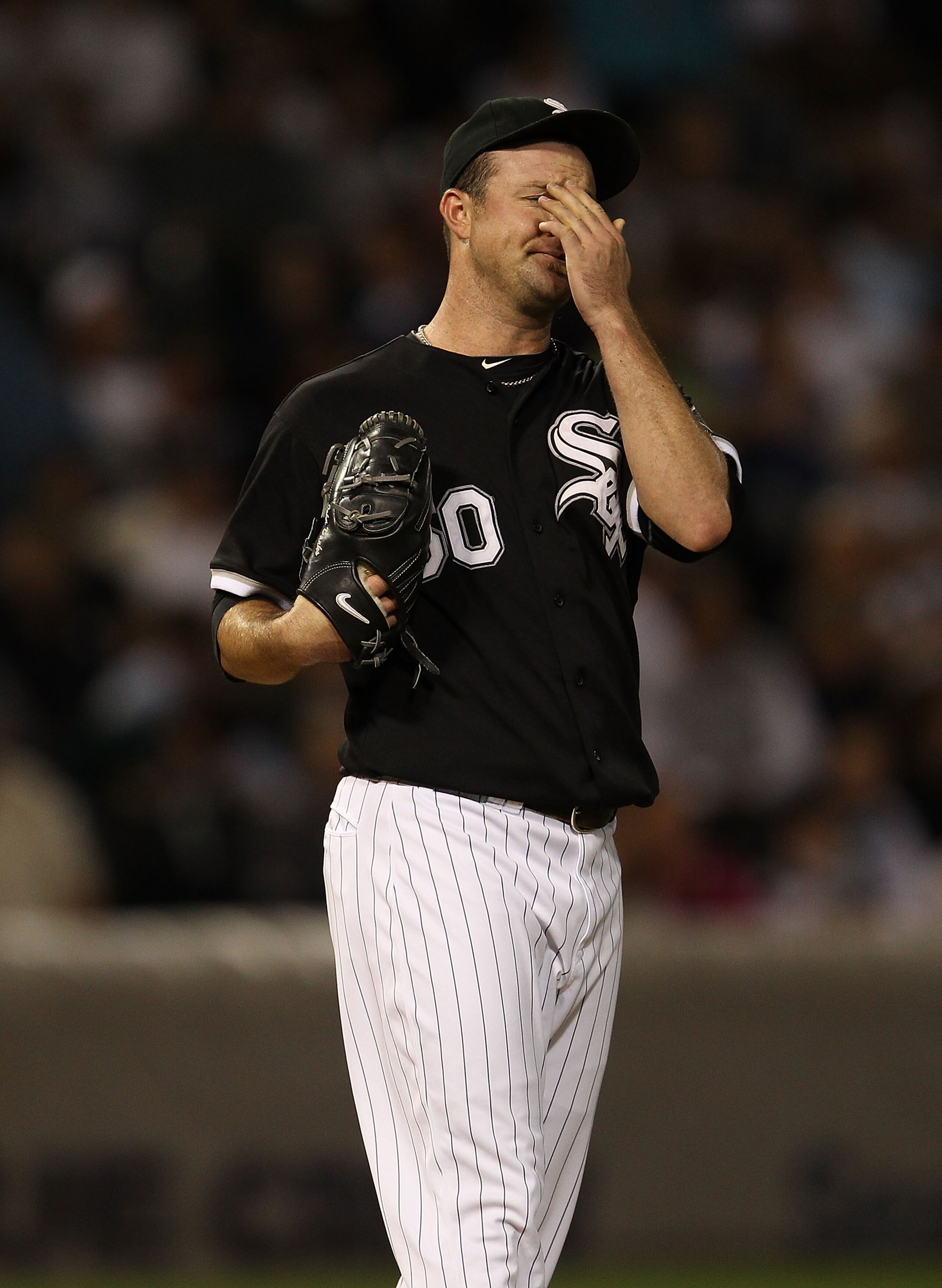 CHICAGO - SEPTEMBER 14: Starting pitcher John Danks #50 of the Chicago White Sox reacts after giving up a run to the Minnesota Twins at U.S. Cellular Field on September 14, 2010 in Chicago, Illinois. (Photo by Jonathan Daniel/Getty Images)