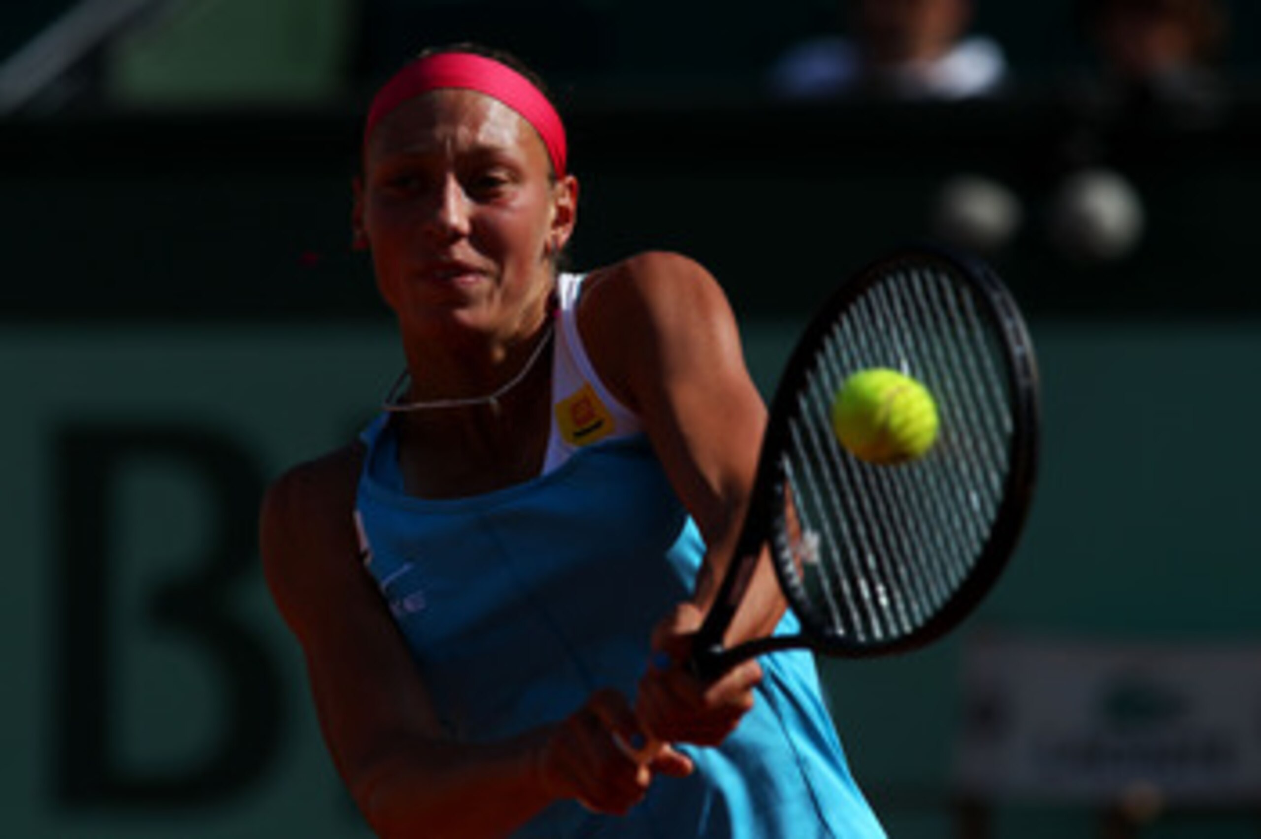 PARIS, FRANCE - MAY 28:  Yanina Wickmayer of Belgium hits a backhand during the women's singles round three match between Yanina Wickmayer of Belgium and Agnieszka Radwanska of Poland on day seven of the French Open at Roland Garros on May 28, 2011 in Par