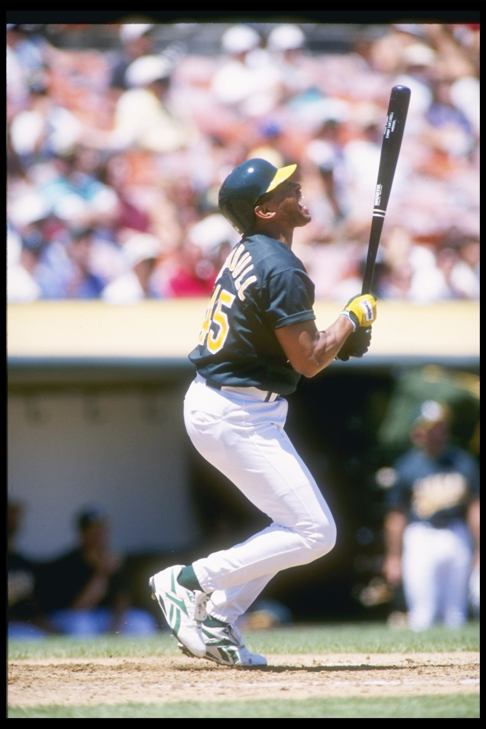 2 Aug 1995:  Outfielder Danny Tartabull of the Oakland Athletics looks up after hitting the ball during a game against the Texas Rangers at the Oakland Coliseum in Oakland, California.  The Rangers won the game 5-4. Mandatory Credit: Otto Greule  /Allspor