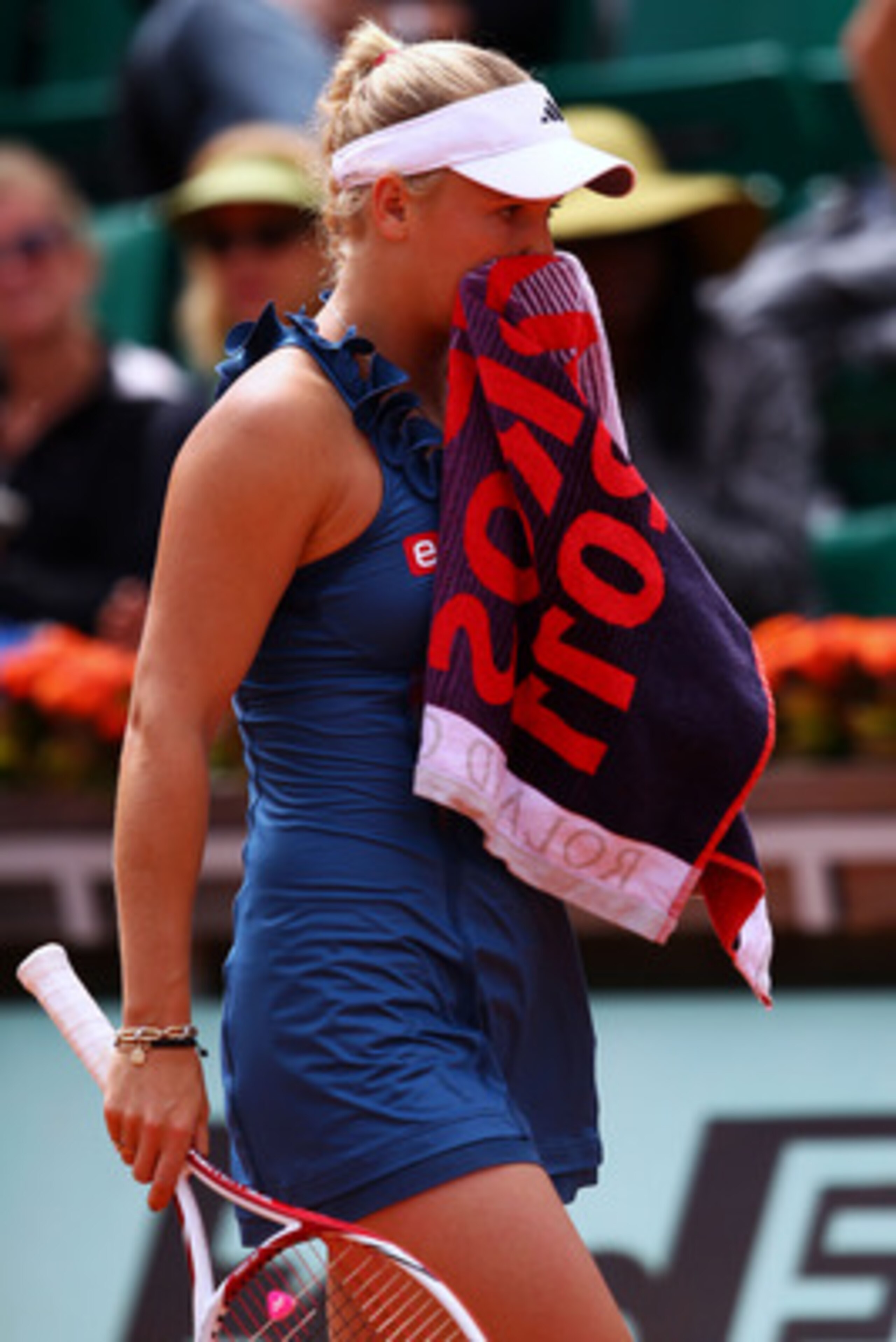 PARIS, FRANCE - MAY 27:  Caroline Wozniacki of Denmark wipes her face with a towel as she shows her dejection during the women's singles round three match between Caroline Wozniacki of Denmark and Daniela Hantuchova of Slovakia on day six of the French Op