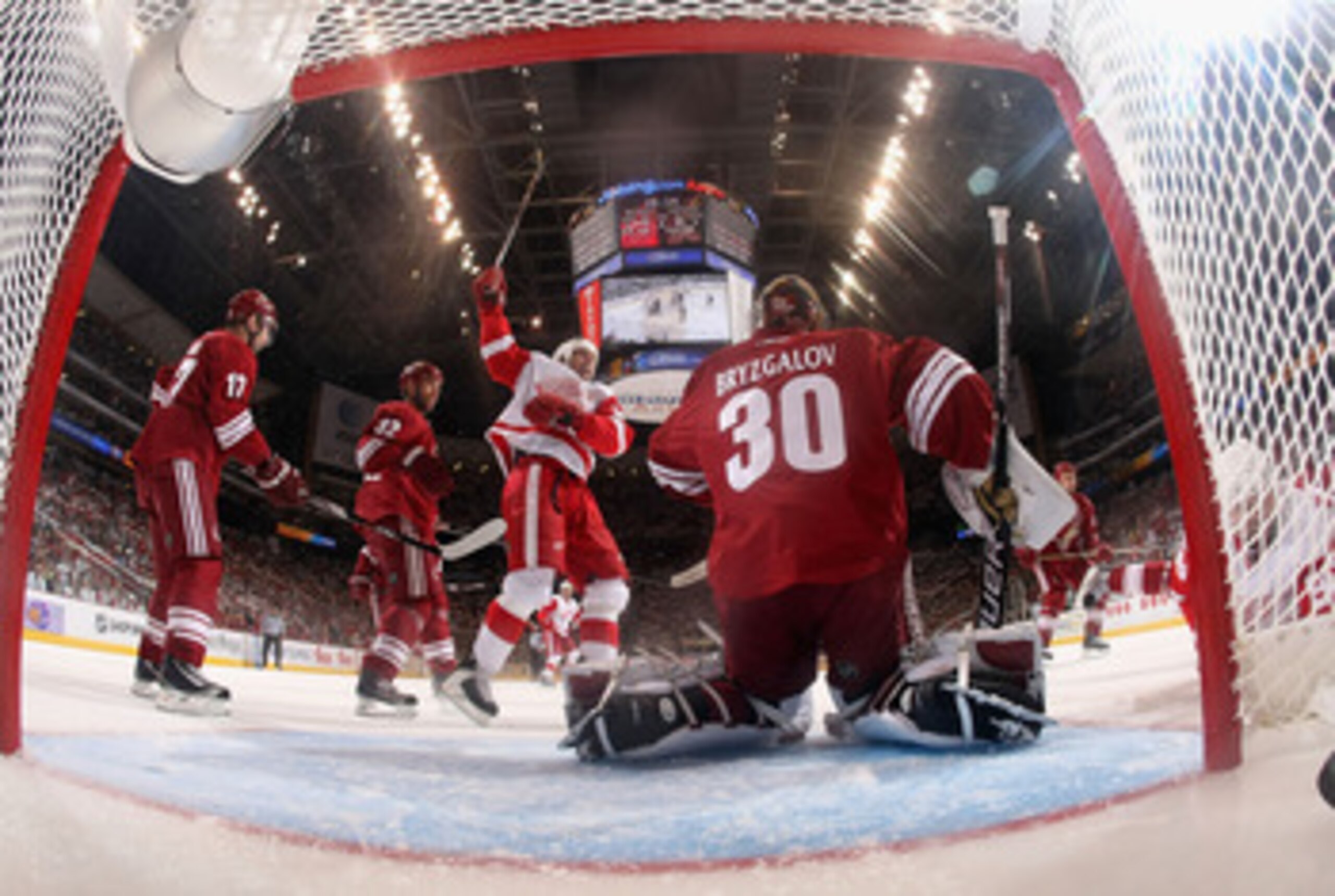 GLENDALE, AZ - APRIL 20:  Mike Modano #90 of the Detroit Red Wings celebrates after Tomas Holmstrom (R) scored a first period goal past goaltender Ilya Bryzgalov #30 of the Phoenix Coyotes in Game Four of the Western Conference Quarterfinals during the 20