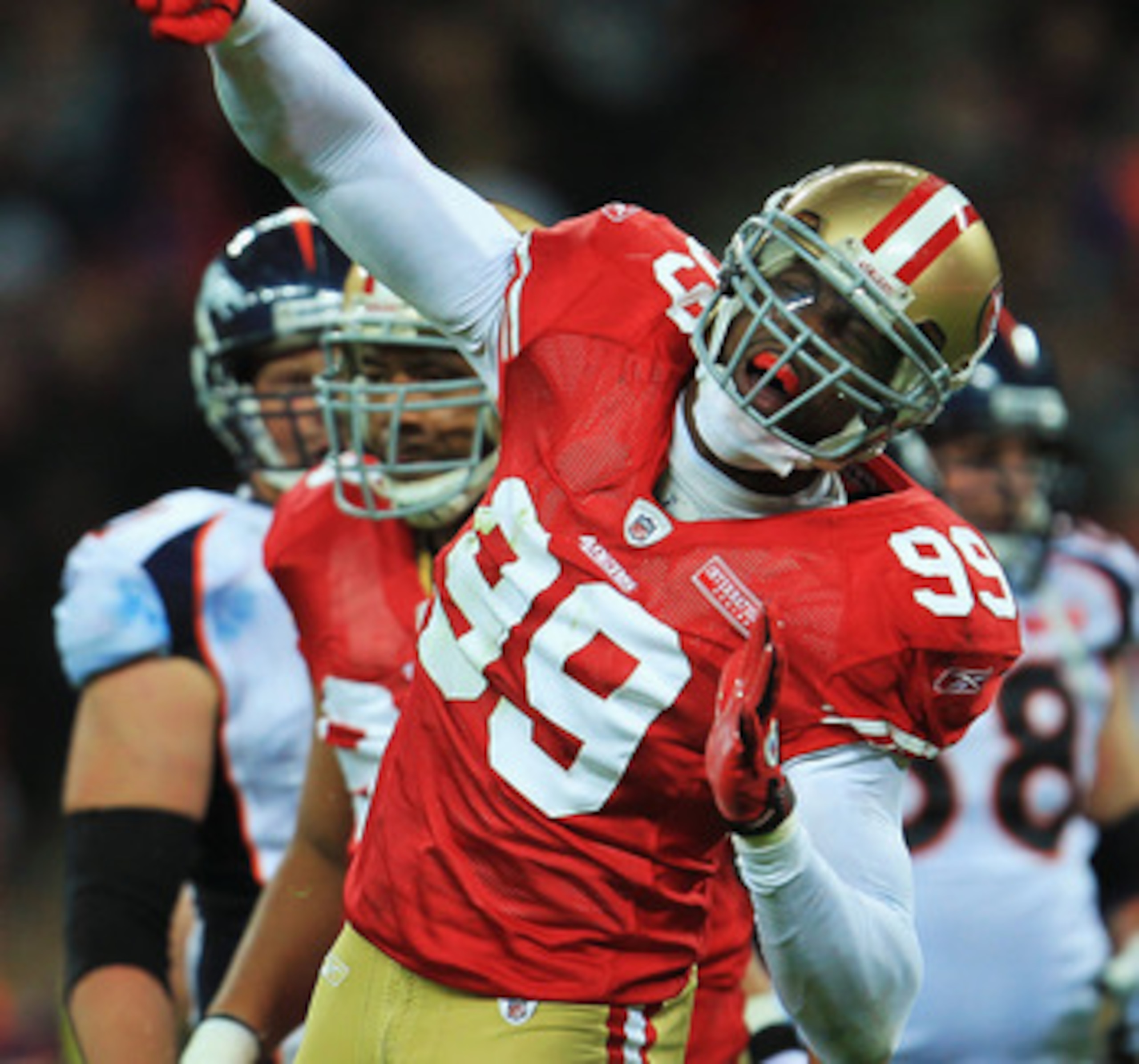 LONDON, ENGLAND - OCTOBER 31:  Manny Lawson #99 of San Francisco 49ers celebrates as he sacks Kyle Orton #8 of Denver Broncos during the NFL International Series match between Denver Broncos and San Francisco 49ers at Wembley Stadium on October 31, 2010 i