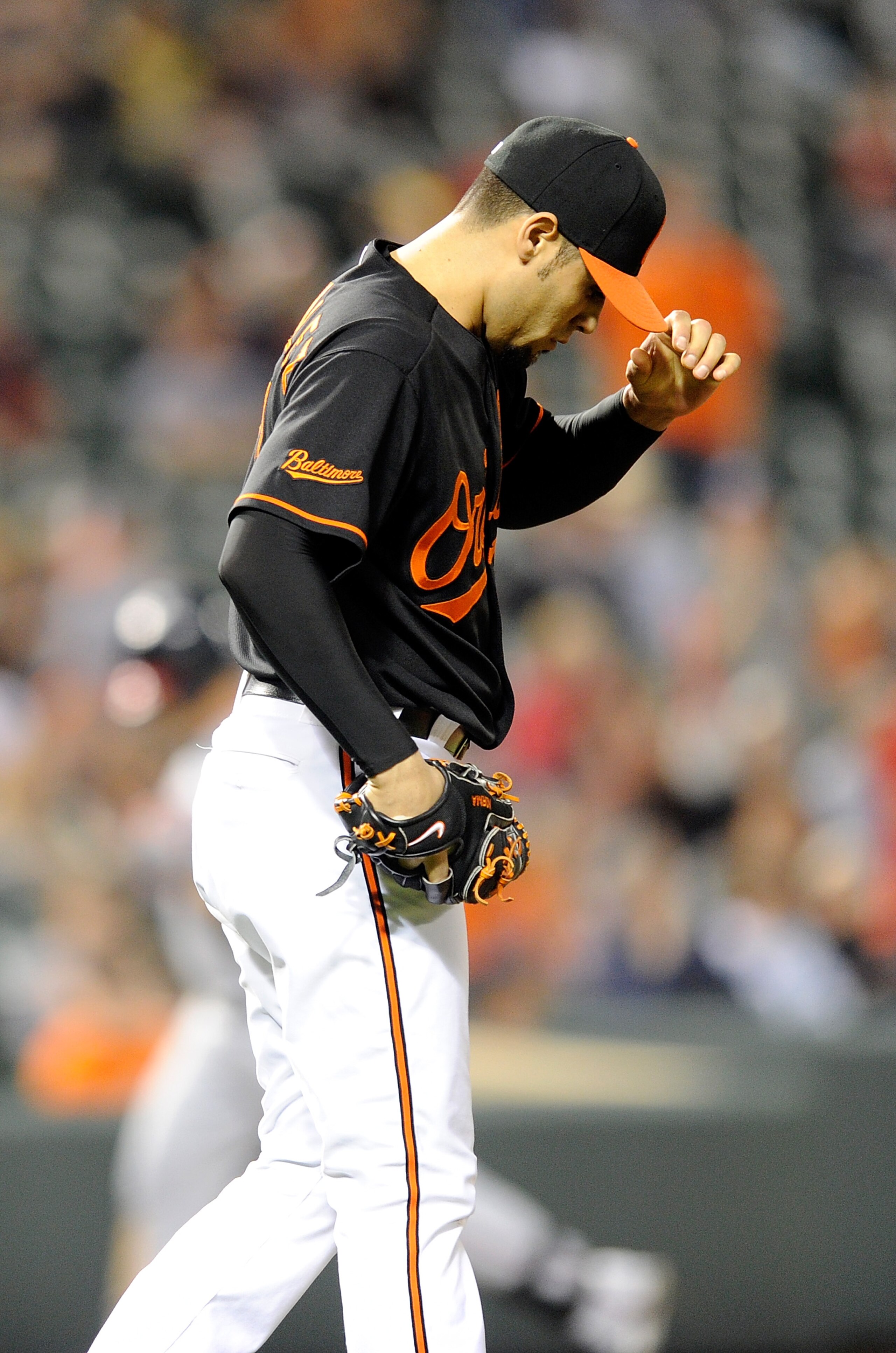 BALTIMORE, MD - MAY 20:  Michael Gonzalez #51 of the Baltimore Orioles reacts after giving up a home run in the eighth inning against the Washington Nationals at Oriole Park at Camden Yards on May 20, 2011 in Baltimore, Maryland.  (Photo by Greg Fiume/Get