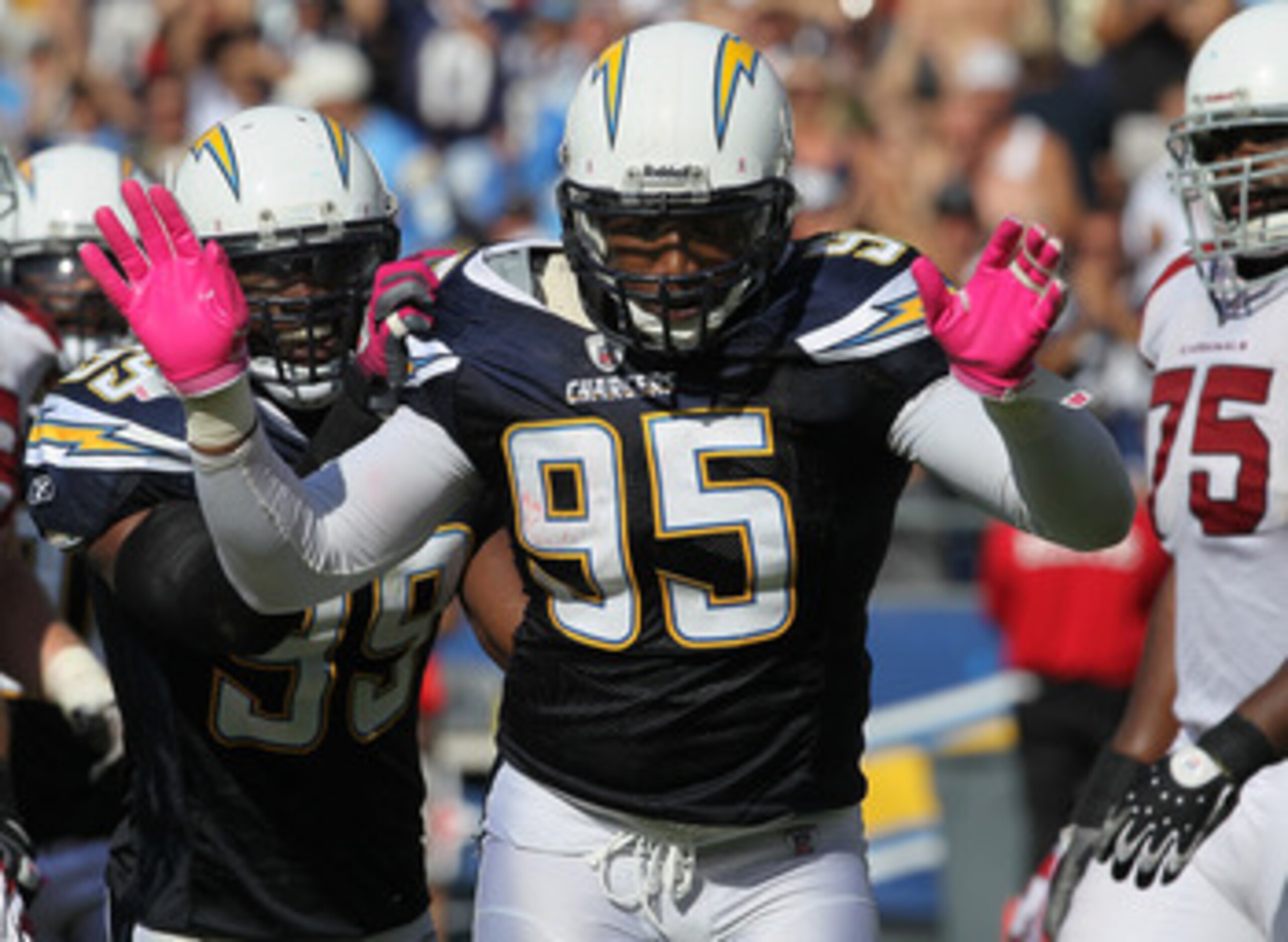 SAN DIEGO - OCTOBER 03:  Linebackers Shaun Phillips #95 and Kevin Burnett #99 of the San Diego Chargers celebrate a Phillips sack against the Arizona Cardinals at Qualcomm Stadium on October 3, 2010 in San Diego, California.   The Chargers won 41-10.  (Ph