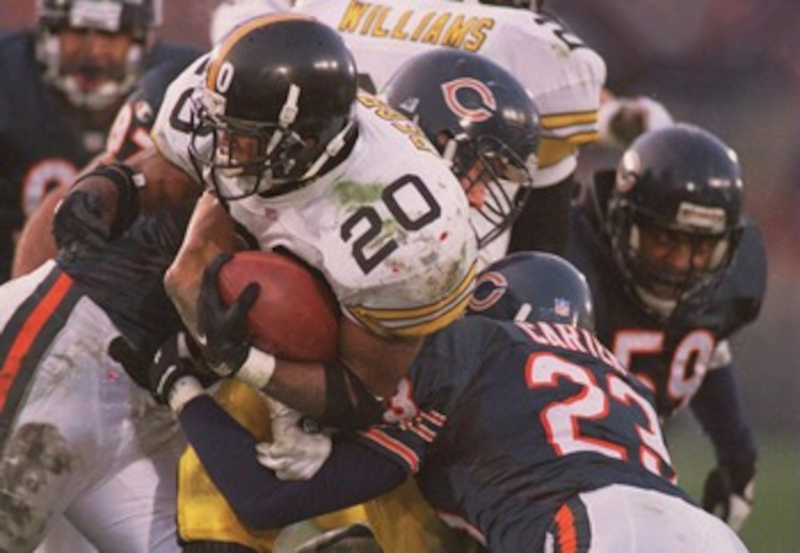 5 NOV 1995:  PITTSBURGH RUNNING BACK ERRIC PEGRAM, #20, IS WRAPPED UP BY MARTY CARTER, #23, AND JIM FLANIGAN, #99, OF CHICAGO IN THE SECOND QUARTER AT SOLDIER FIELD IN CHICAGO, ILLINOIS. Mandatory Credit: Matthew Stockman/ALLSPORT