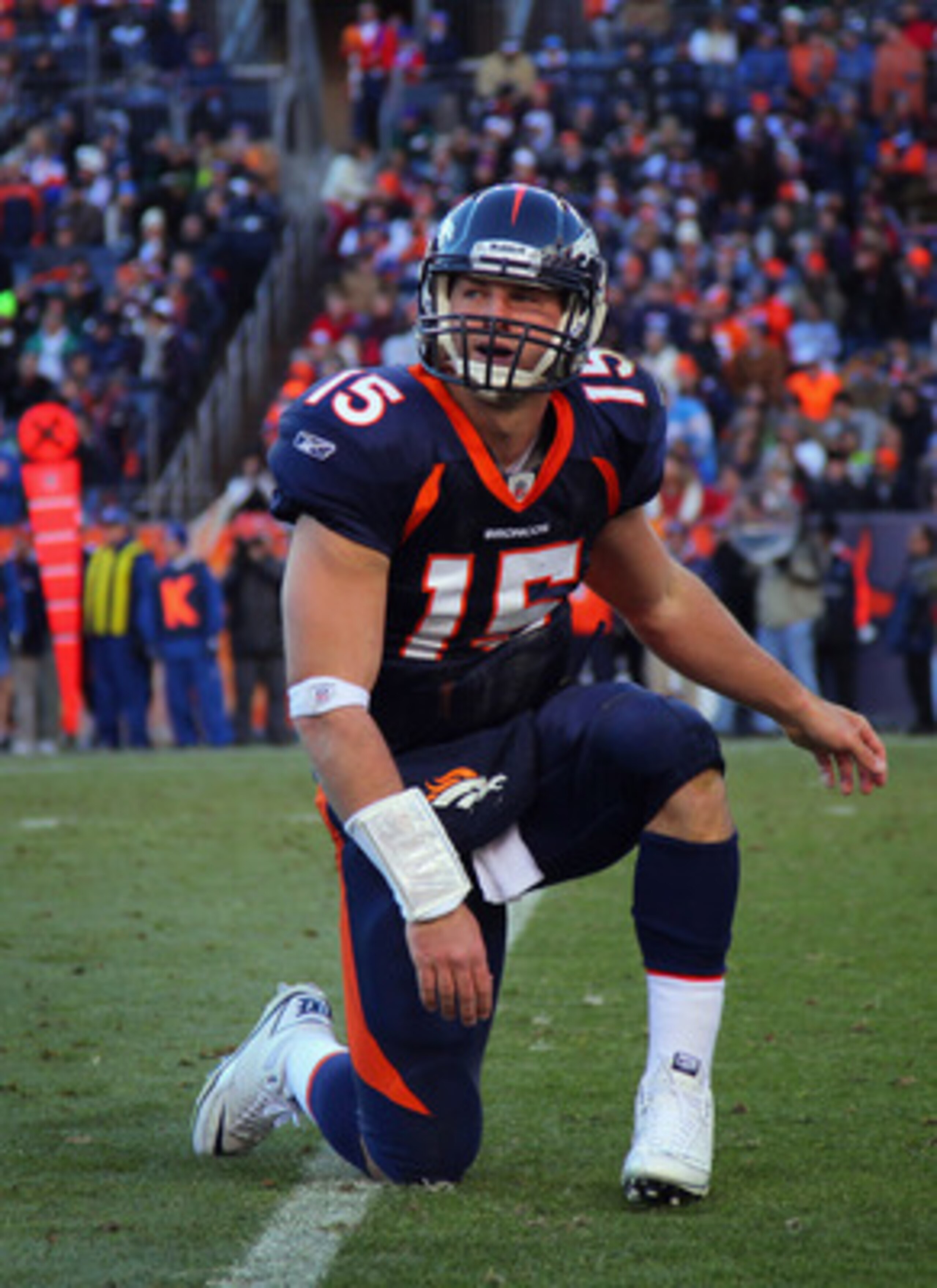 DENVER - JANUARY 02: Quarterback Tim Tebow #15 of the Denver Broncos gets back on his feet after being knocked down against the San Diego Chargers at INVESCO Field at Mile High on January 2, 2011 in Denver, Colorado. (Photo by Doug Pensinger/Getty Image DENVER - JANUARY 02: Quarterback Tim Tebow #15 of the Denver Broncos gets back on his feet after being knocked down against the San Diego Chargers at INVESCO Field at Mile High on January 2, 2011 in Denver, Colorado. (Photo by Doug Pensinger/Getty Image