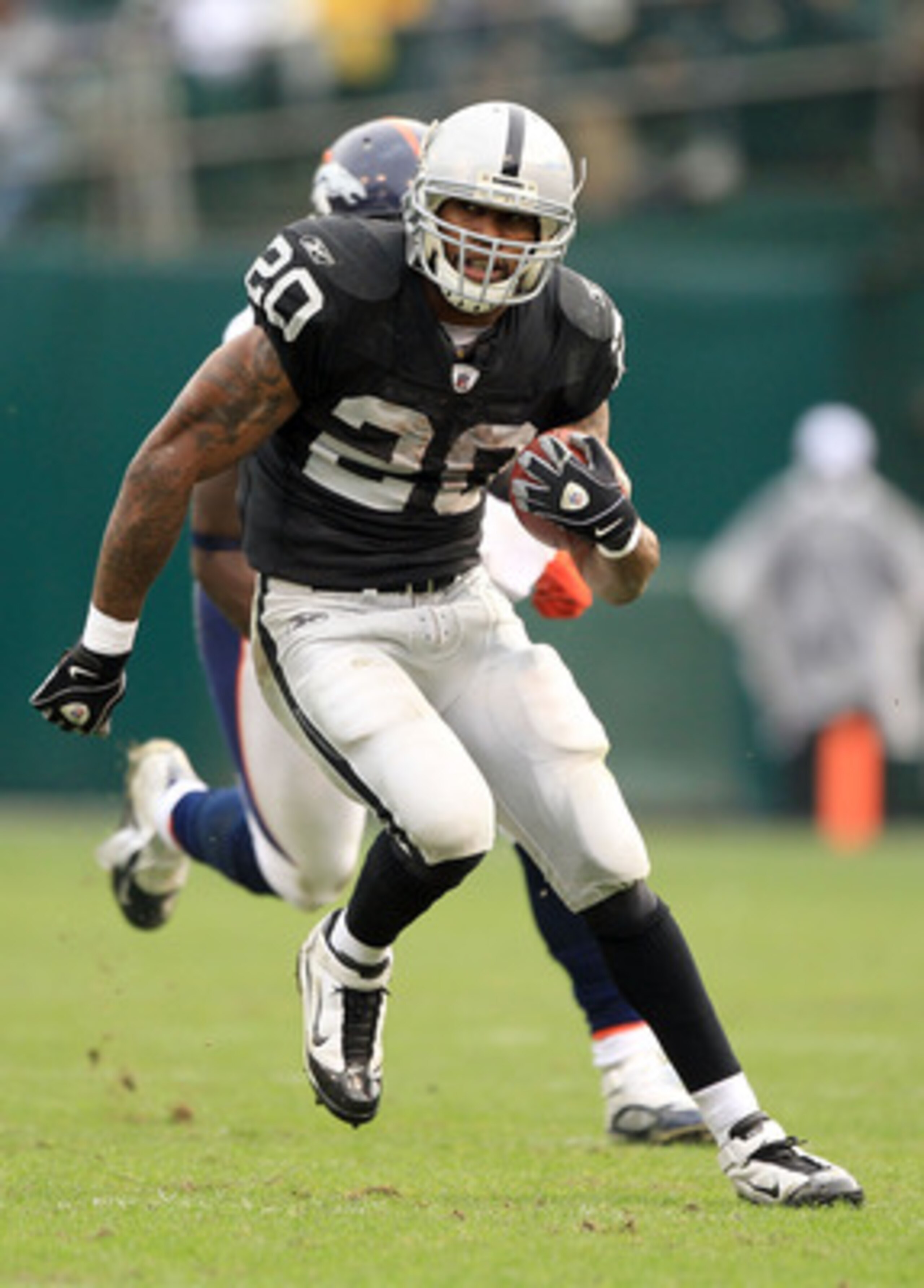 OAKLAND, CA - DECEMBER 19: Darren McFadden #20 of the Oakland Raiders runs with the ball during their game against the Denver Broncos at Oakland-Alameda County Coliseum on December 19, 2010 in Oakland, California. (Photo by Ezra Shaw/Getty Images) OAKLAND, CA - DECEMBER 19: Darren McFadden #20 of the Oakland Raiders runs with the ball during their game against the Denver Broncos at Oakland-Alameda County Coliseum on December 19, 2010 in Oakland, California. (Photo by Ezra Shaw/Getty Images)