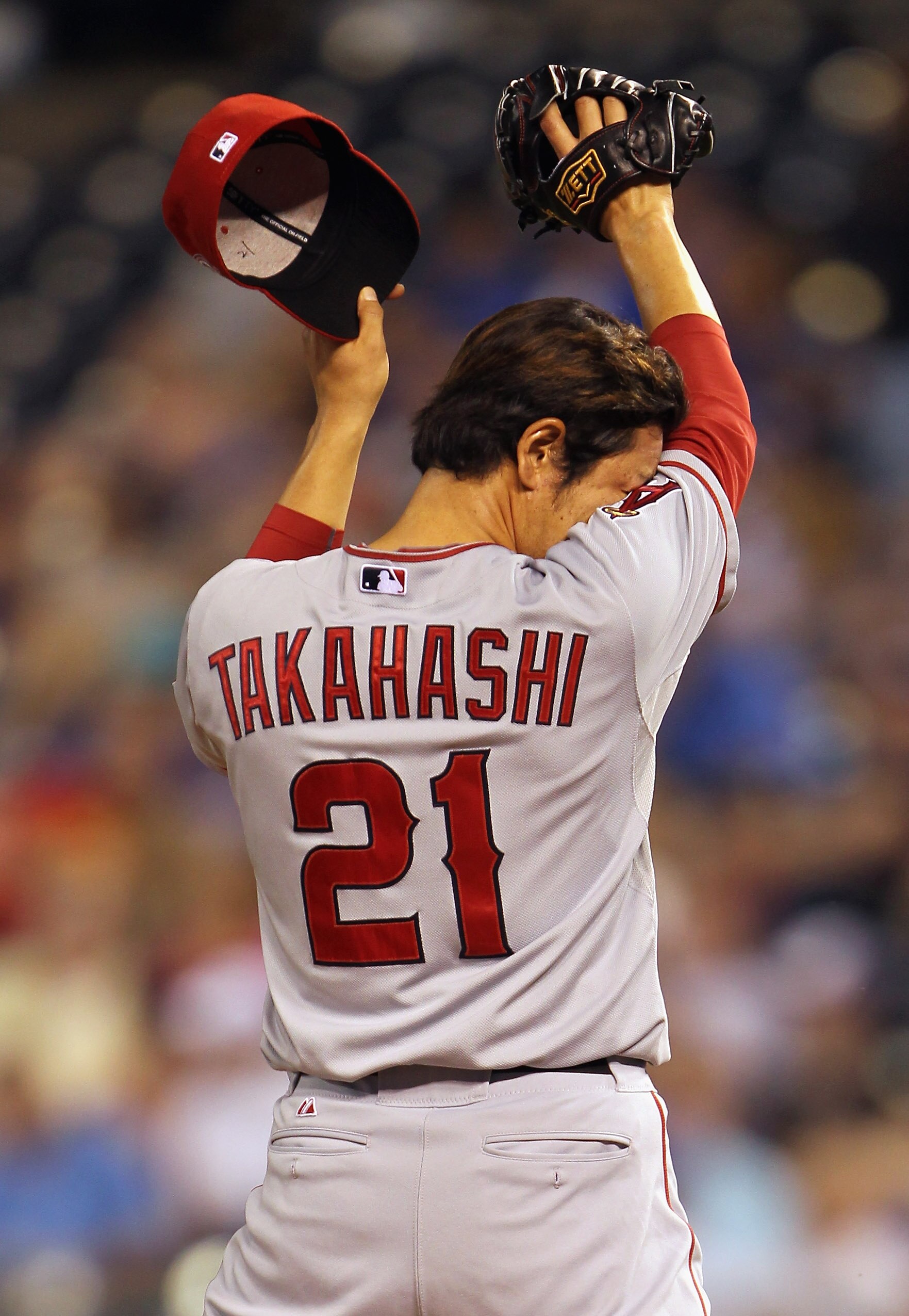 KANSAS CITY, MO - MAY 31:  Pitcher Hisanori Takahashi #21 of the Los Angeles Angels of Anaheim in action during the game against the Kansas City Royals on May 31, 2011 at Kauffman Stadium in Kansas City, Missouri.  (Photo by Jamie Squire/Getty Images)