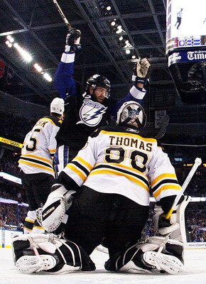 TAMPA, FL - MAY 25:  Simon Gagne #12 of the Tampa Bay Lightning celebrates a goal by Teddy Purcell #16 as Tim Thomas #30 of the Boston Bruins defends in Game Six of the Eastern Conference Finals during the 2011 NHL Stanley Cup Playoffs at St Pete Times Fo