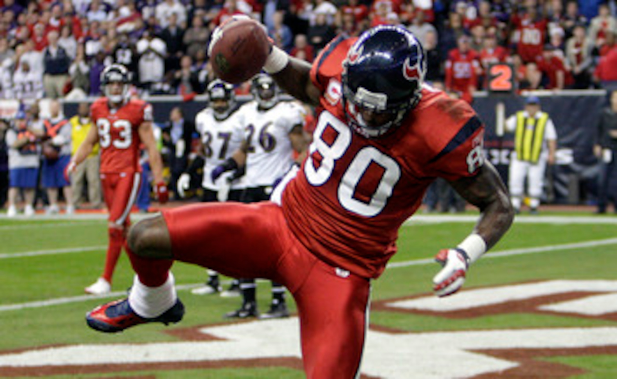 HOUSTON, TX - DECEMBER 13:  Wide receiver Andre Johnson #80 of the Houston Texans comes scores as he get's his foot down in the endzone in the fourth quarter against the Baltimore Ravens at Reliant Stadium on December 13, 2010 in Houston, Texas. Baltimore