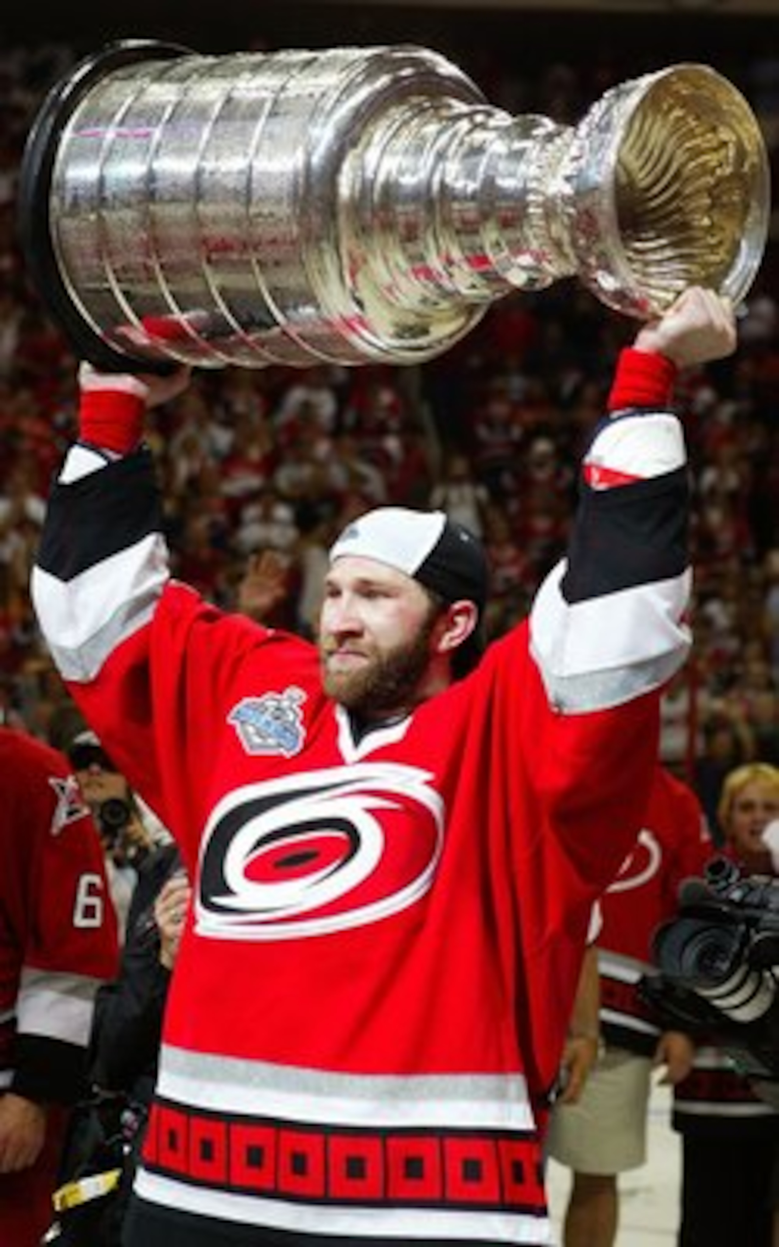 RALEIGH, NC - JUNE 19: Erik Cole #26 of the Carolina Hurricanes celebrates with the Stanley Cup after defeating the Edmonton Oilers in game seven of the 2006 NHL Stanley Cup Finals on June 19, 2006 at the RBC Center in Raleigh, North Carolina. The Hurrica