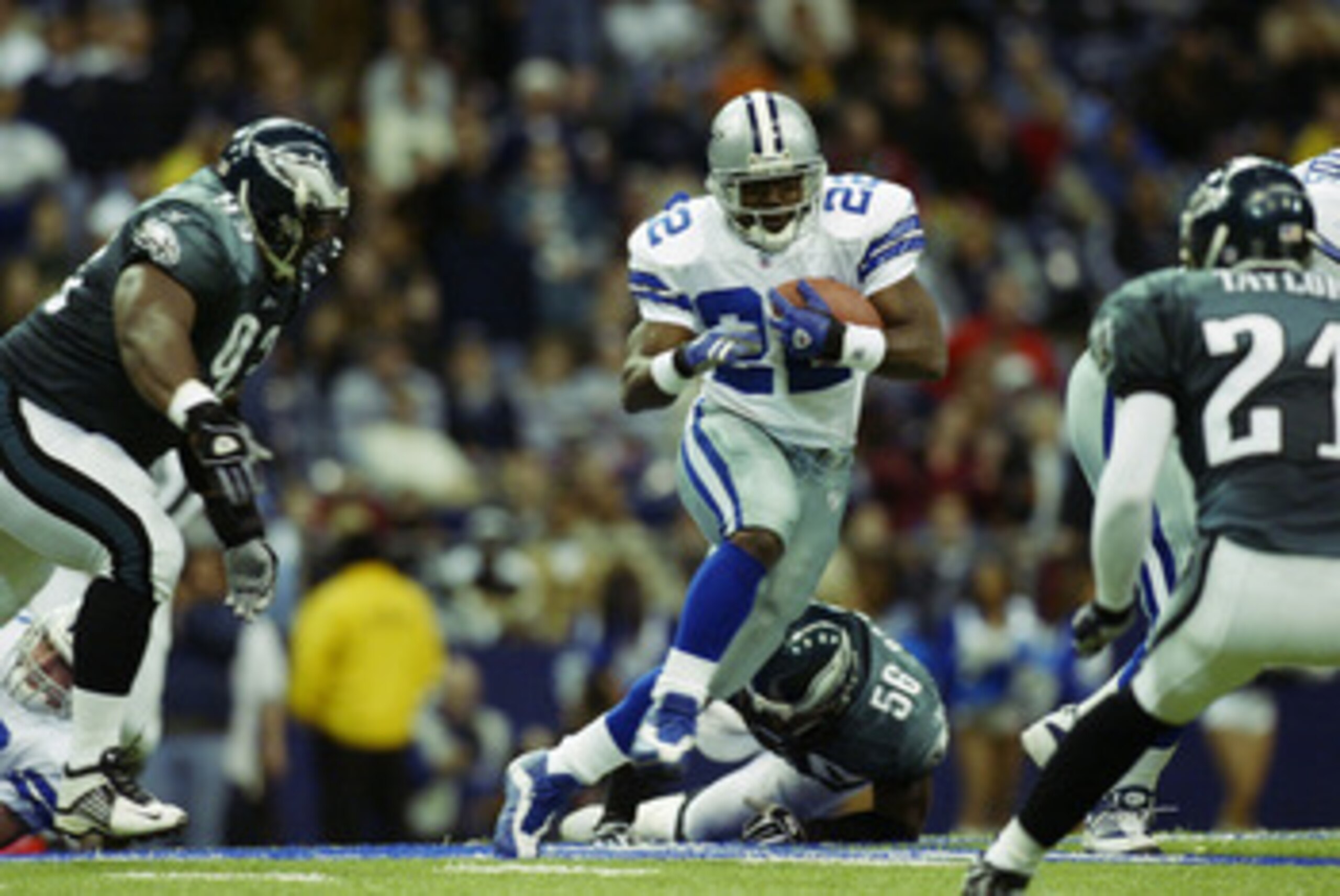 IRVING, TX - DECEMBER 21:  Running back Emmitt Smith #22 of the Dallas Cowboys runs the ball against the Philadelphia Eagles at Texas Stadium on December 21, 2002 in Irving, Texas.  The Eagles defeated the Cowboys 27-3.  (Photo by Ronald Martinez/Getty Im