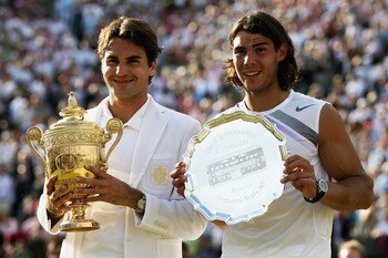 LONDON - JULY 08:  Roger Federer of Switzerland poses with the winners trophy alongside runner-up Rafael Nadal of Spain following the Men's Singles final match during day thirteen of the Wimbledon Lawn Tennis Championships at the All England Lawn Tennis a