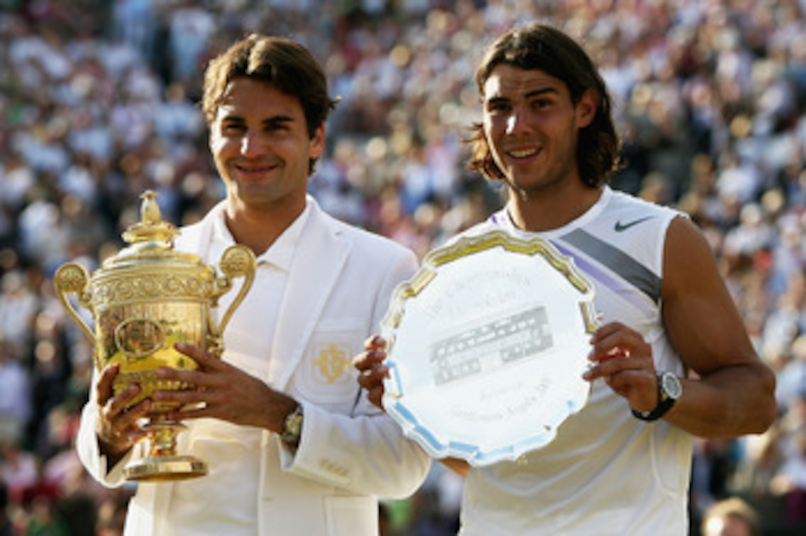 LONDON - JULY 08:  Roger Federer of Switzerland poses with the winners trophy alongside runner-up Rafael Nadal of Spain following the Men's Singles final match during day thirteen of the Wimbledon Lawn Tennis Championships at the All England Lawn Tennis a
