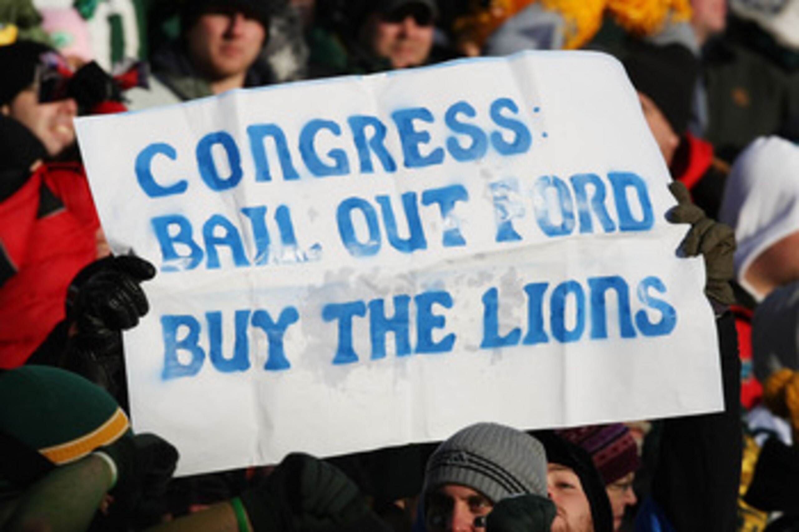 GREEN BAY, WI - DECEMBER 28: Fans hold a sign during a game between the Green Bay Packers and the Detroit Lions on December 28, 2008 at Lambeau Field in Green Bay, Wisconsin. The Packers defeated the Lions 31-21. (Photo by Jonathan Daniel/Getty Images)