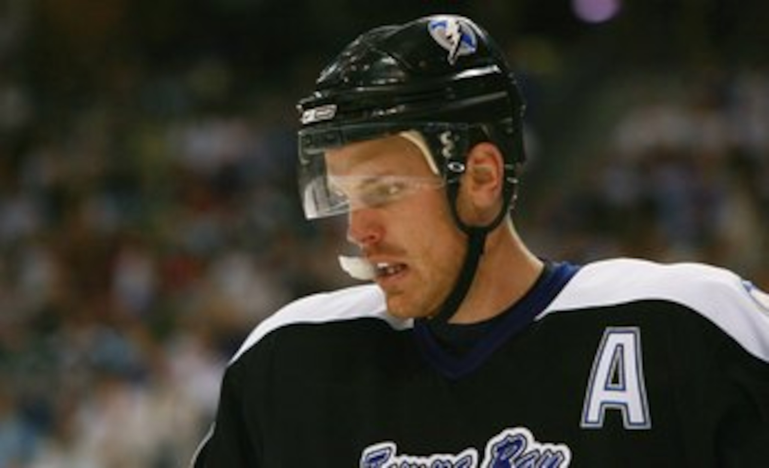 TAMPA - APRIL 22:  A dejected Brad Richards #19 of the Tampa Bay Lightning looks on against the New Jersey Devils in Game 6 of the Eastern Conference Quarter-finals during the 2007 NHL Stanley Cup Playoffs on April 22, 2007 at the St. Pete Times Forum in