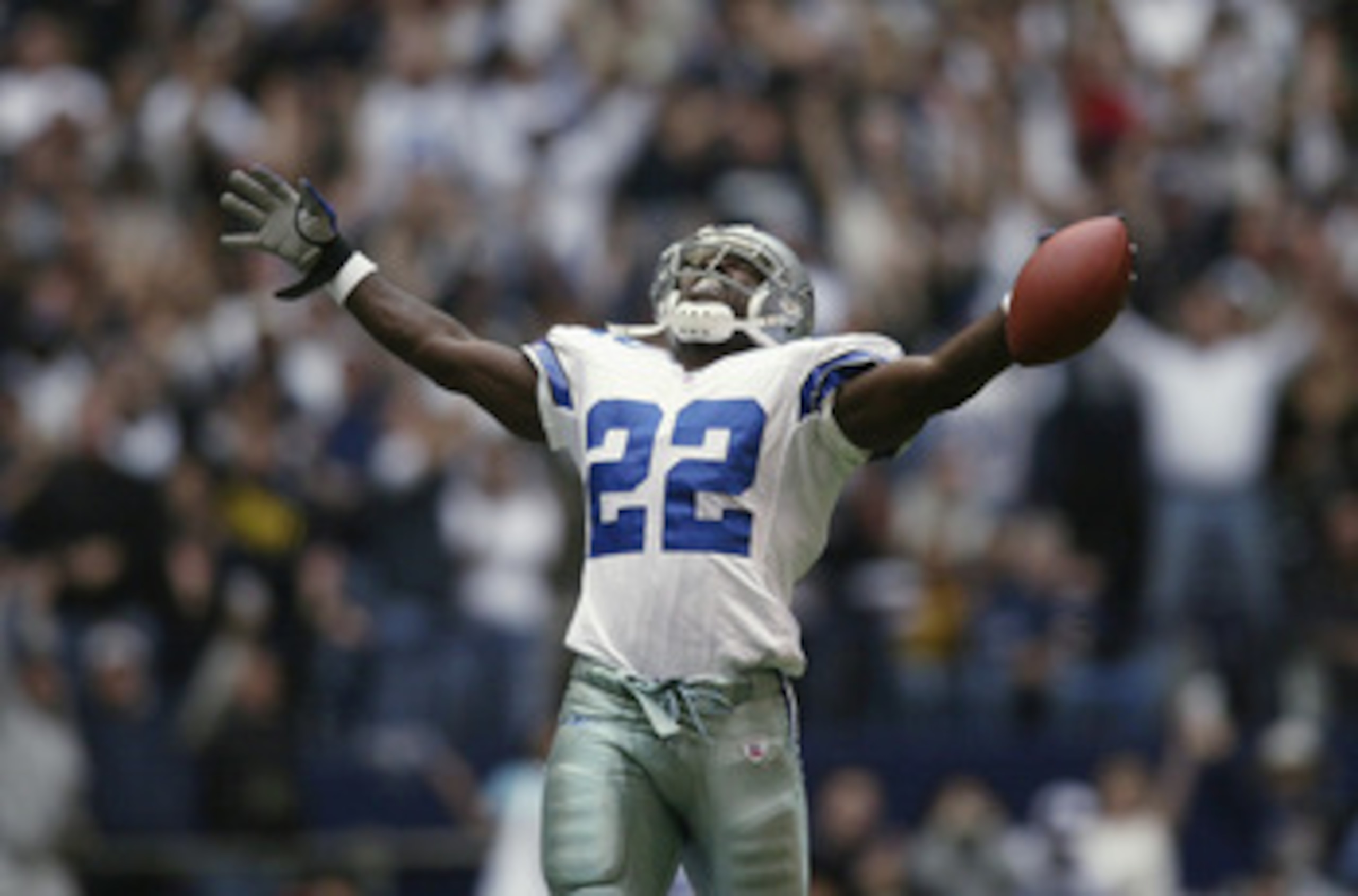 IRVING, TX - OCTOBER 27:   Running Back Emmitt Smith #22 of the Dallas Cowboys celebrates beating the NFL rushing record during the NFL game against the Seattle Seahawks at Texas Stadium on October 27, 2002 in Irving, Texas. The Seahawks defeated the Cowb