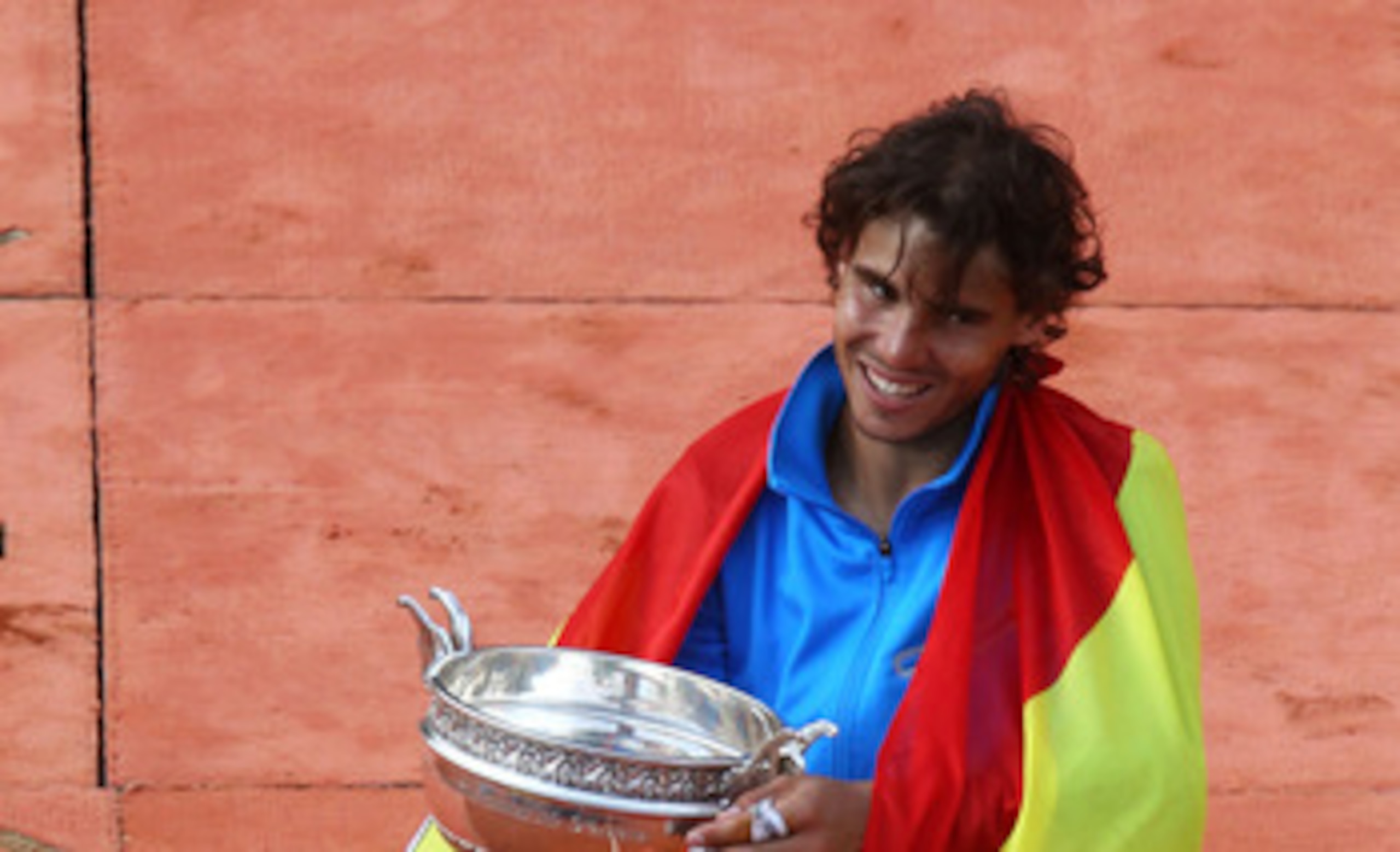 PARIS, FRANCE - JUNE 05: Champion Rafael Nadal of Spain poses with the trophy following his victory during the men's singles final match between Rafael Nadal of Spain and Roger Federer of Switzerland on day fifteen of the French Open at Roland Garros on PARIS, FRANCE - JUNE 05: Champion Rafael Nadal of Spain poses with the trophy following his victory during the men's singles final match between Rafael Nadal of Spain and Roger Federer of Switzerland on day fifteen of the French Open at Roland Garros on