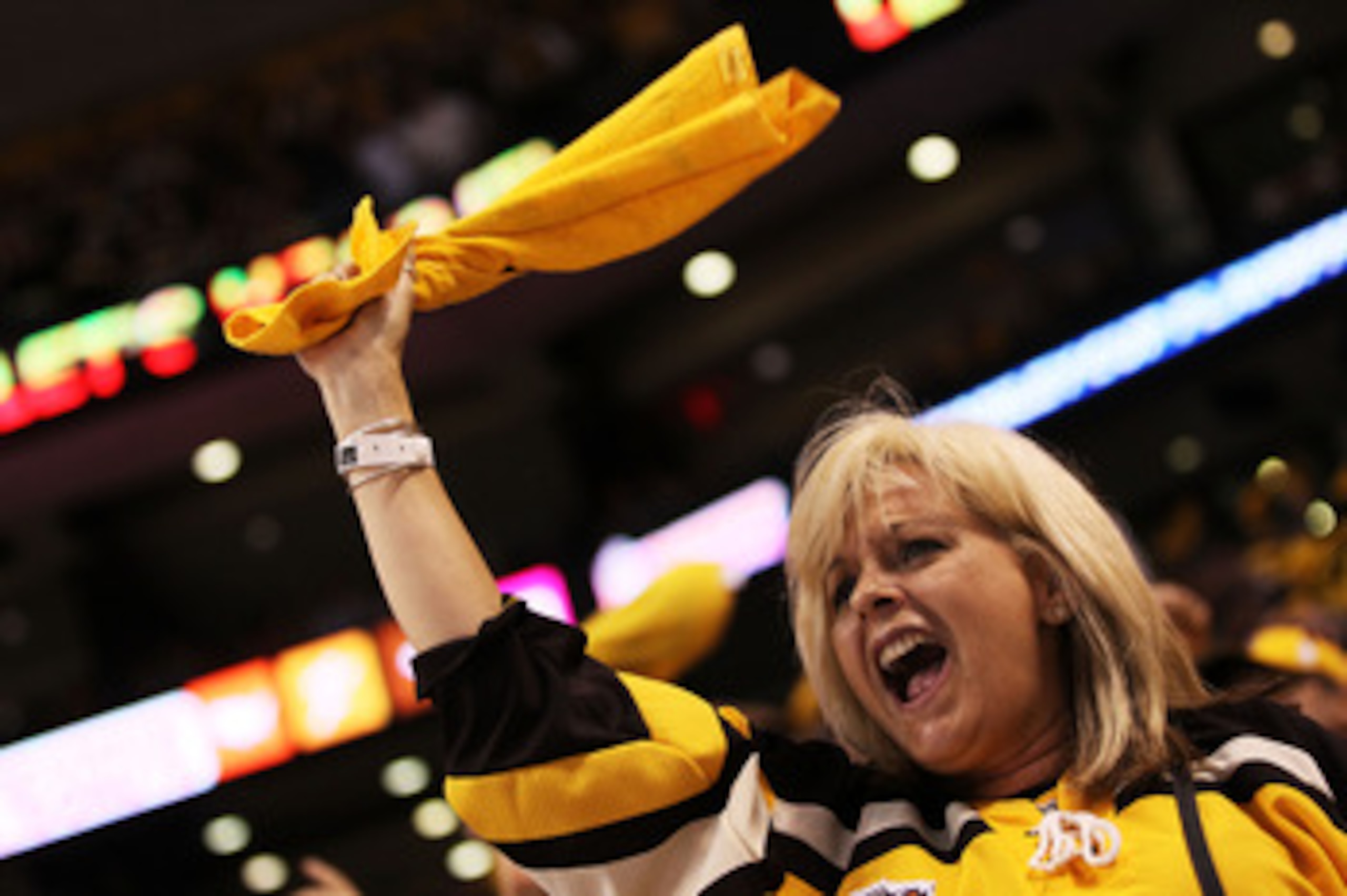 BOSTON, MA - MAY 27:  A Boston Bruins fan cheers during Game Seven of the Eastern Conference Finals against the Tampa Bay Lightning during the 2011 NHL Stanley Cup Playoffs at TD Garden on May 27, 2011 in Boston, Massachusetts.  (Photo by Elsa/Getty Image