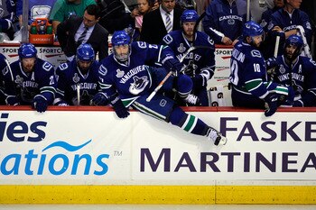 VANCOUVER, BC - JUNE 04:  Manny Malhotra #27 of the Vancouver Canucks hops on the ice during a line change during Game Two against the Boston Bruins in the 2011 NHL Stanley Cup Final at Rogers Arena on June 4, 2011 in Vancouver, British Columbia, Canada. 