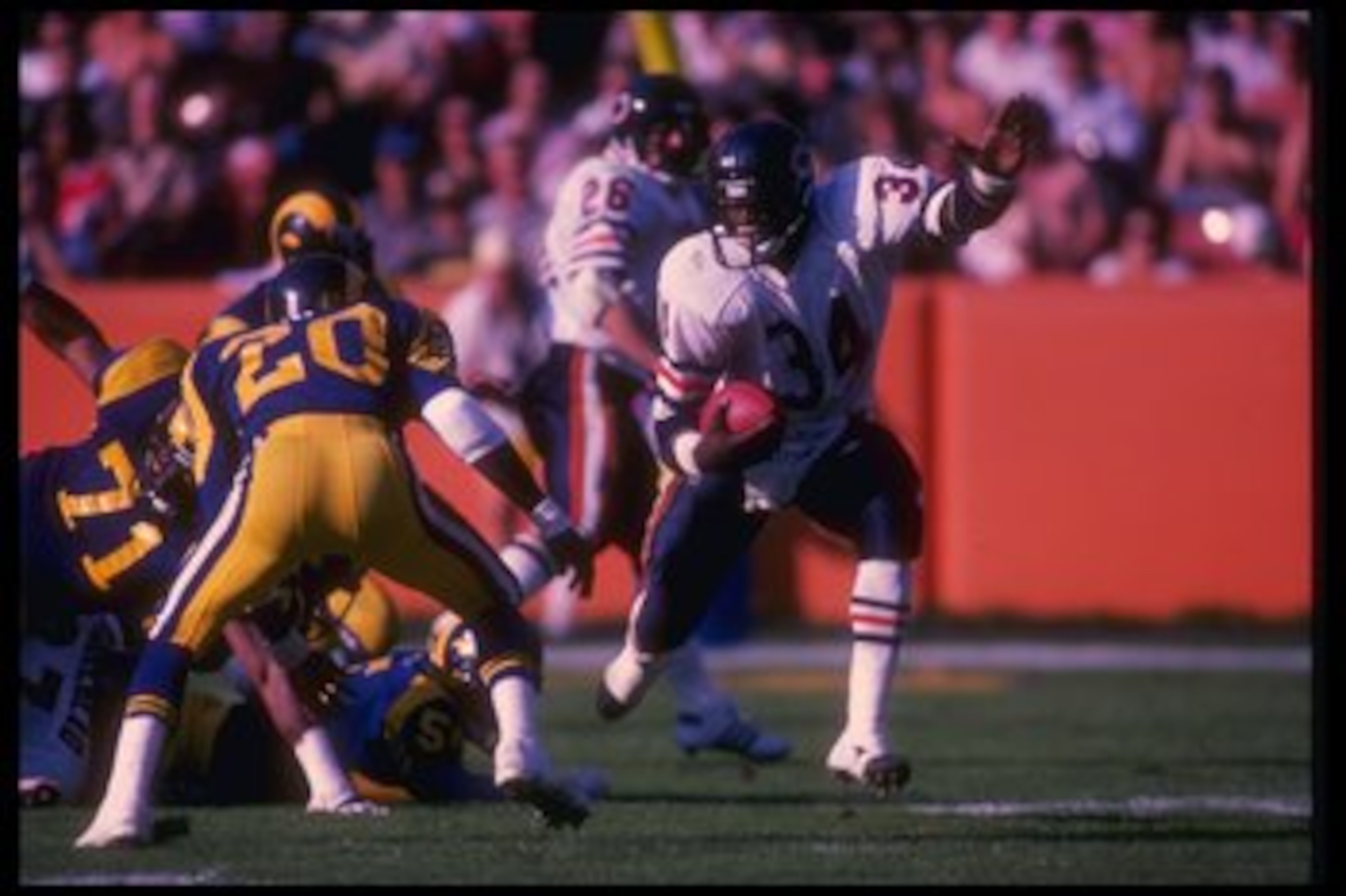 11 Nov 1984:  Running back Walter Payton of the Chicago Bears (right) runs the ball during a game against the Los Angeles Rams at Anaheim Stadium in Anaheim, California.  The Rams won the game, 29-13. Mandatory Credit: Rick Stewart  /Allsport